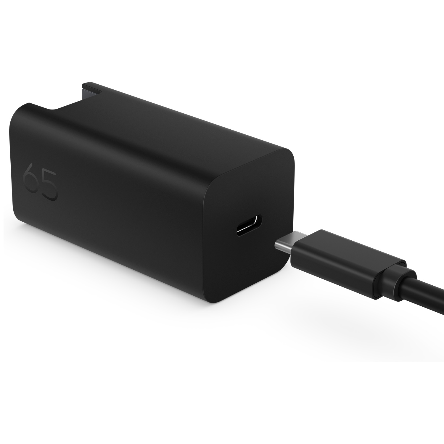 A black 65W USB-C charger with a connected USB-C cable against a white background.