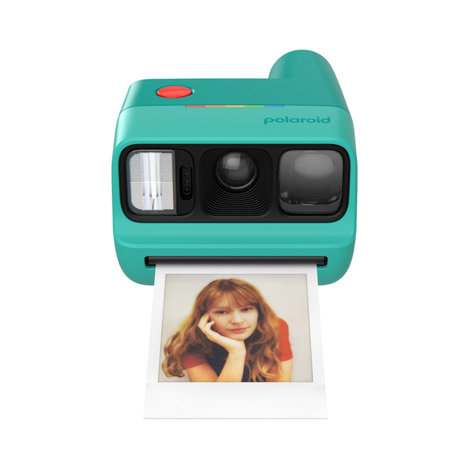 Una fotocamera istantanea Polaroid verde acqua che stampa la foto di una giovane donna con capelli biondi.