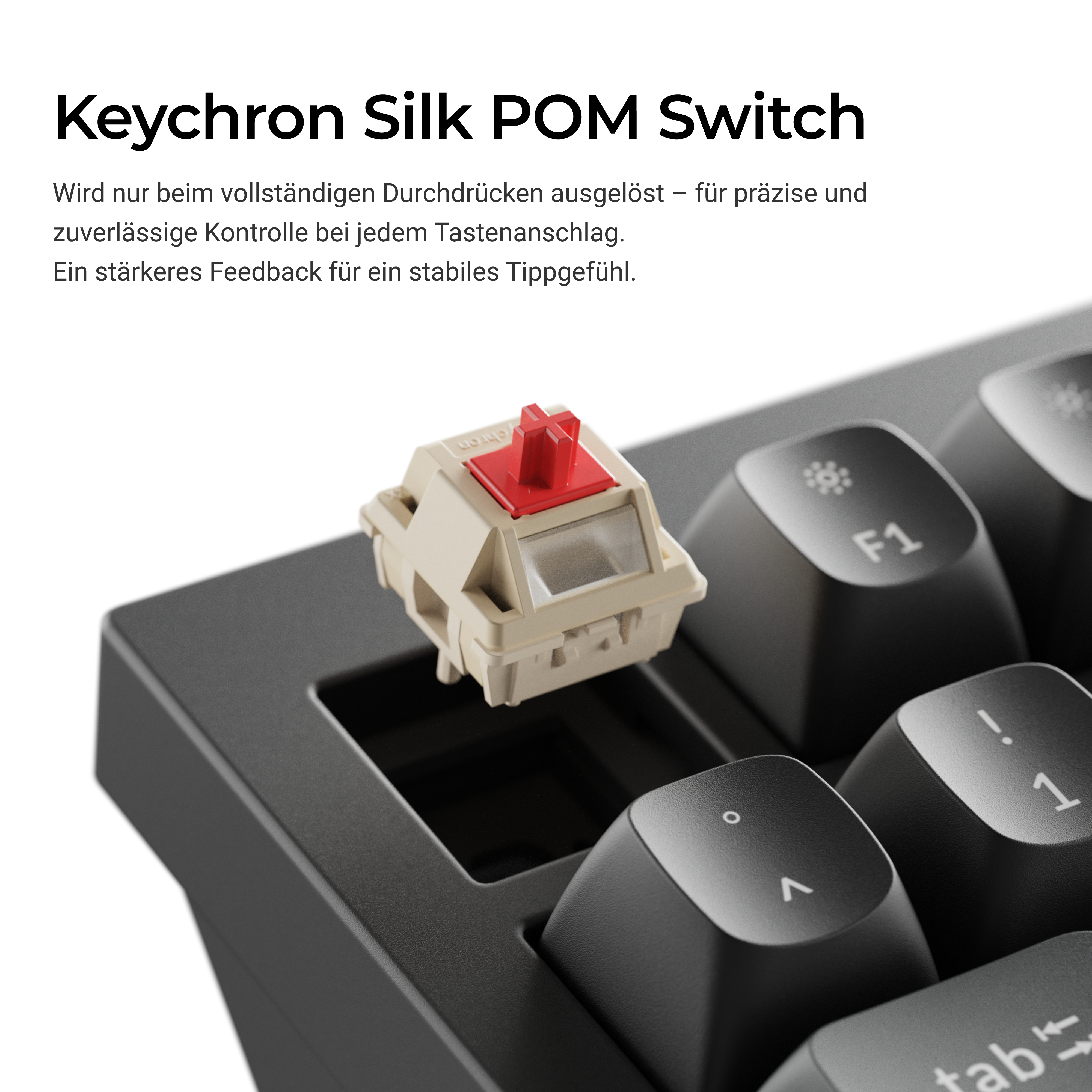 Ein Keychron Silk POM-Switch schwebt über einer Tastatur und zeigt den roten Schaft und das beigefarbene Gehäuse.