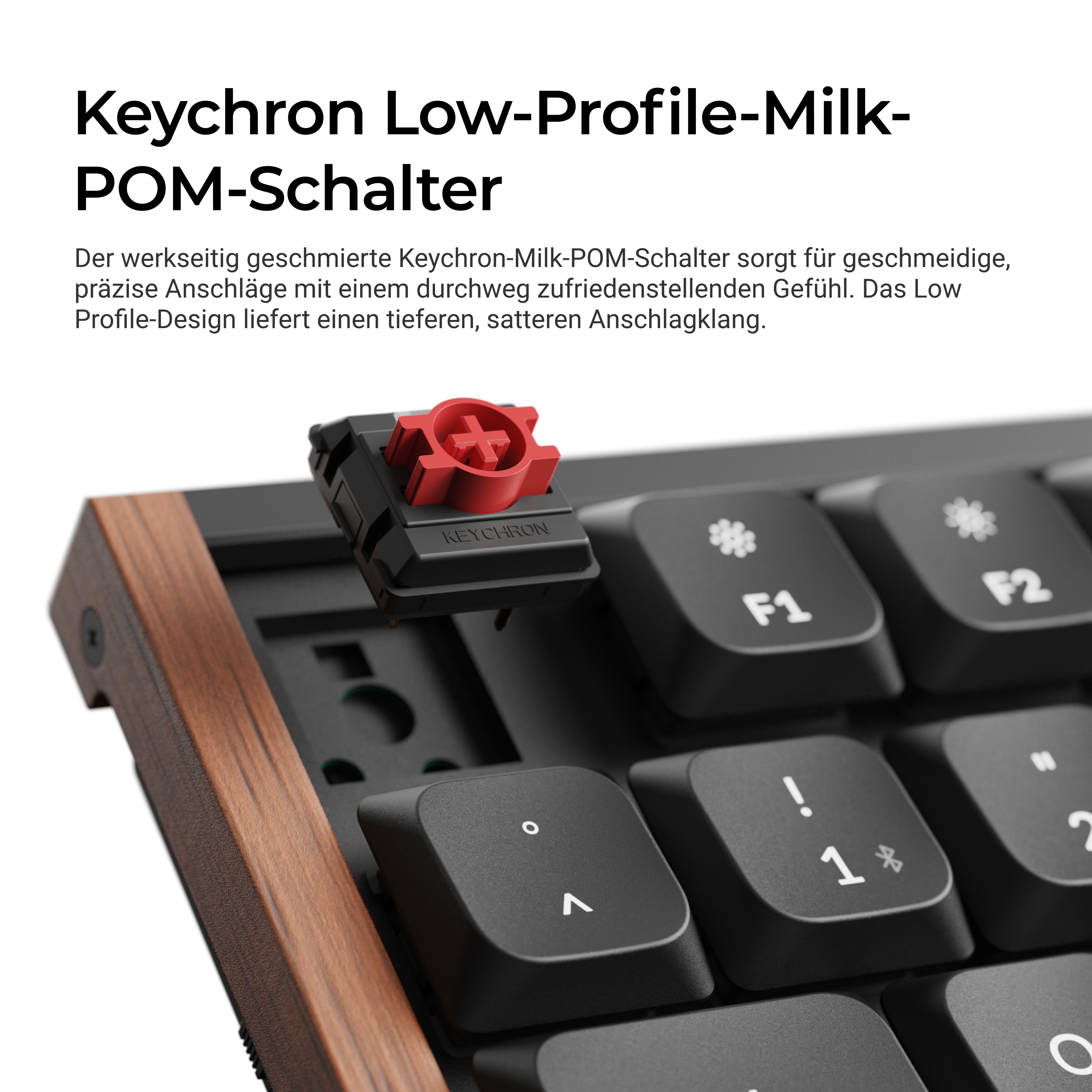 Keychron Low-Profile-Milk-POM-Schalter auf einer Holztastatur.