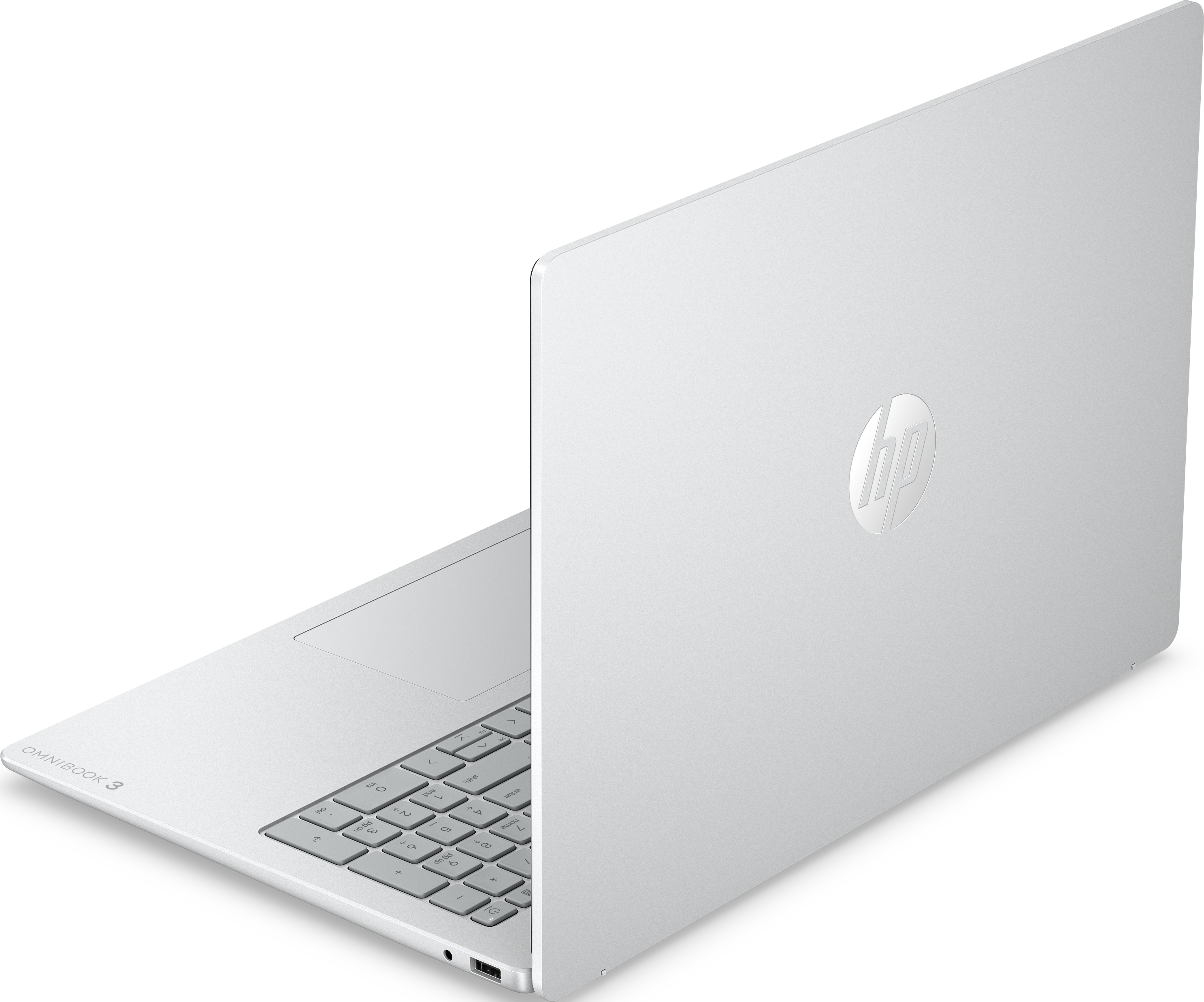 Un ordinateur portable HP Omnibook argenté est présenté sous un angle diagonal arrière sur fond noir.