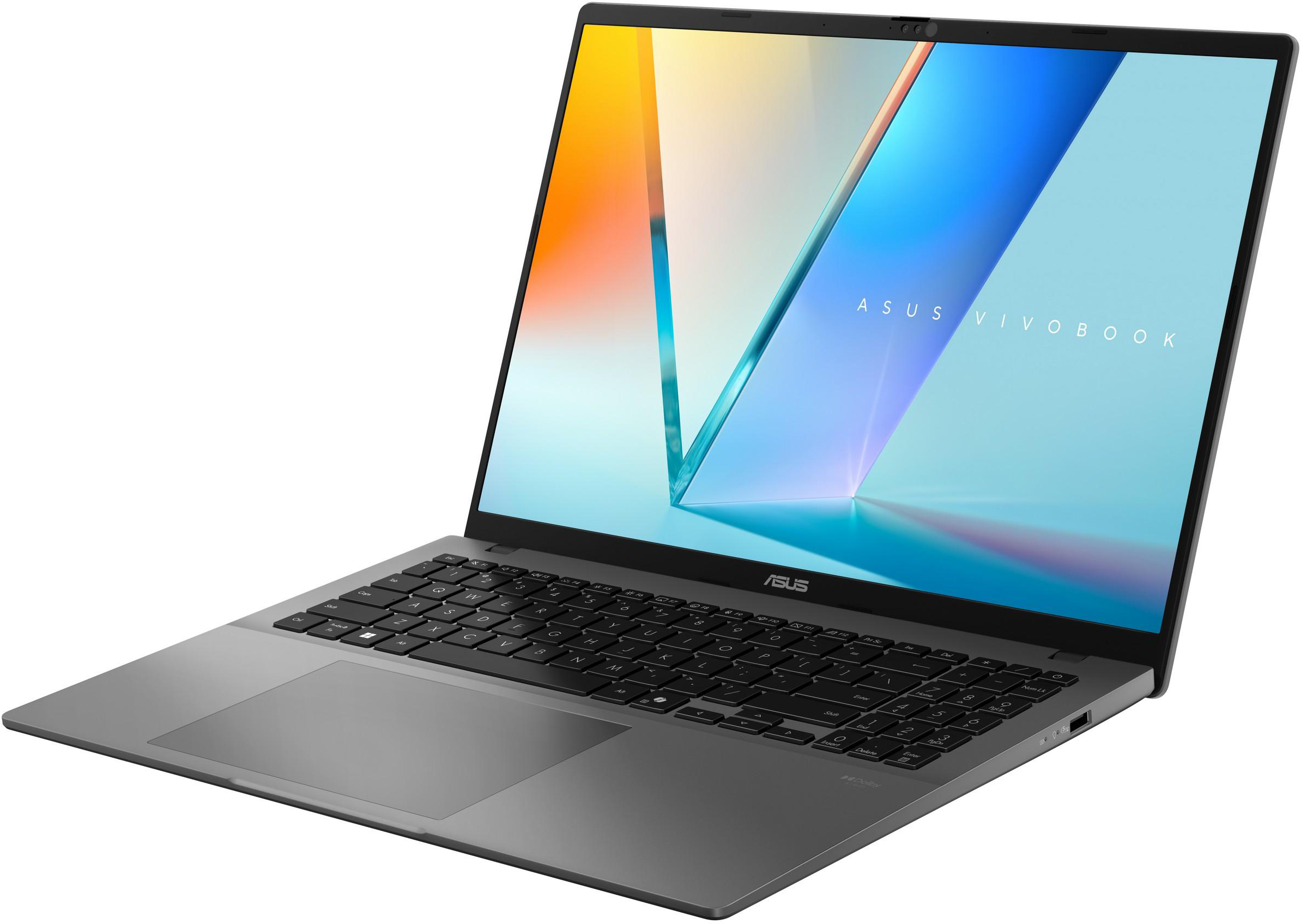 Egy szürke Asus Vivobook laptop nyitva, színes képernyővel és fekete billentyűzettel.