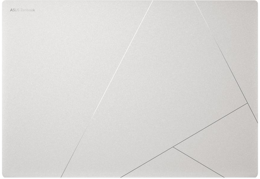 Egy ASUS Zenbook ezüst felülete geometriai vonalakkal.