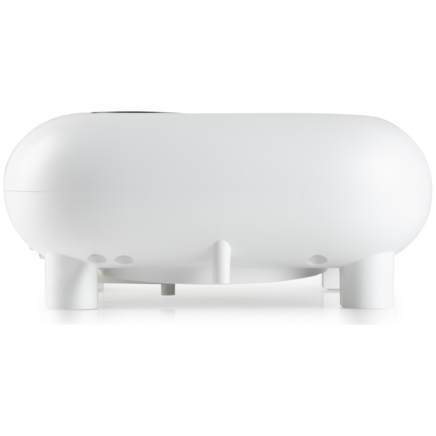 A white, oblong electronic device on four small feet against a white background.