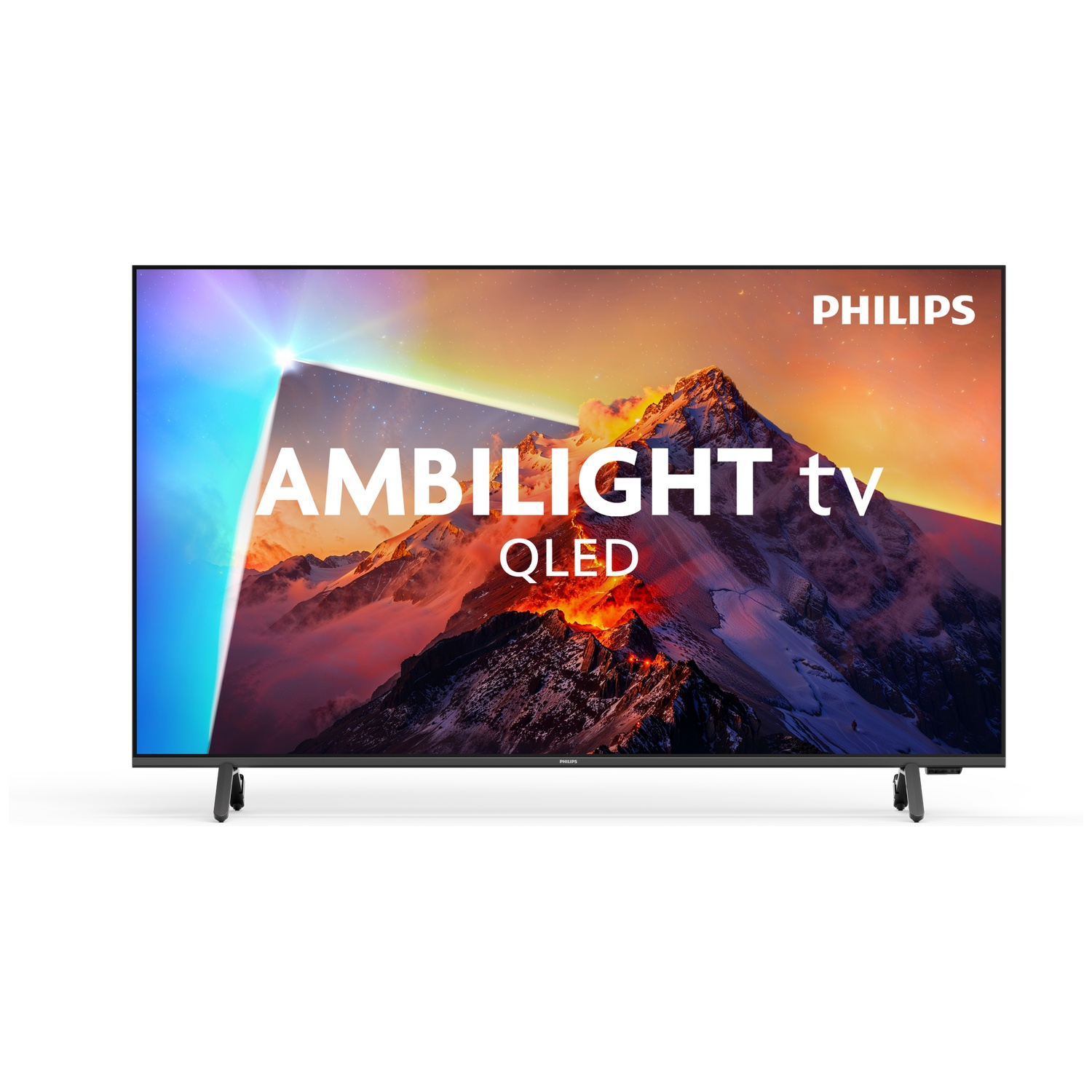 A Philips Ambilight QLED TV displays a mountain landscape with vibrant colors.