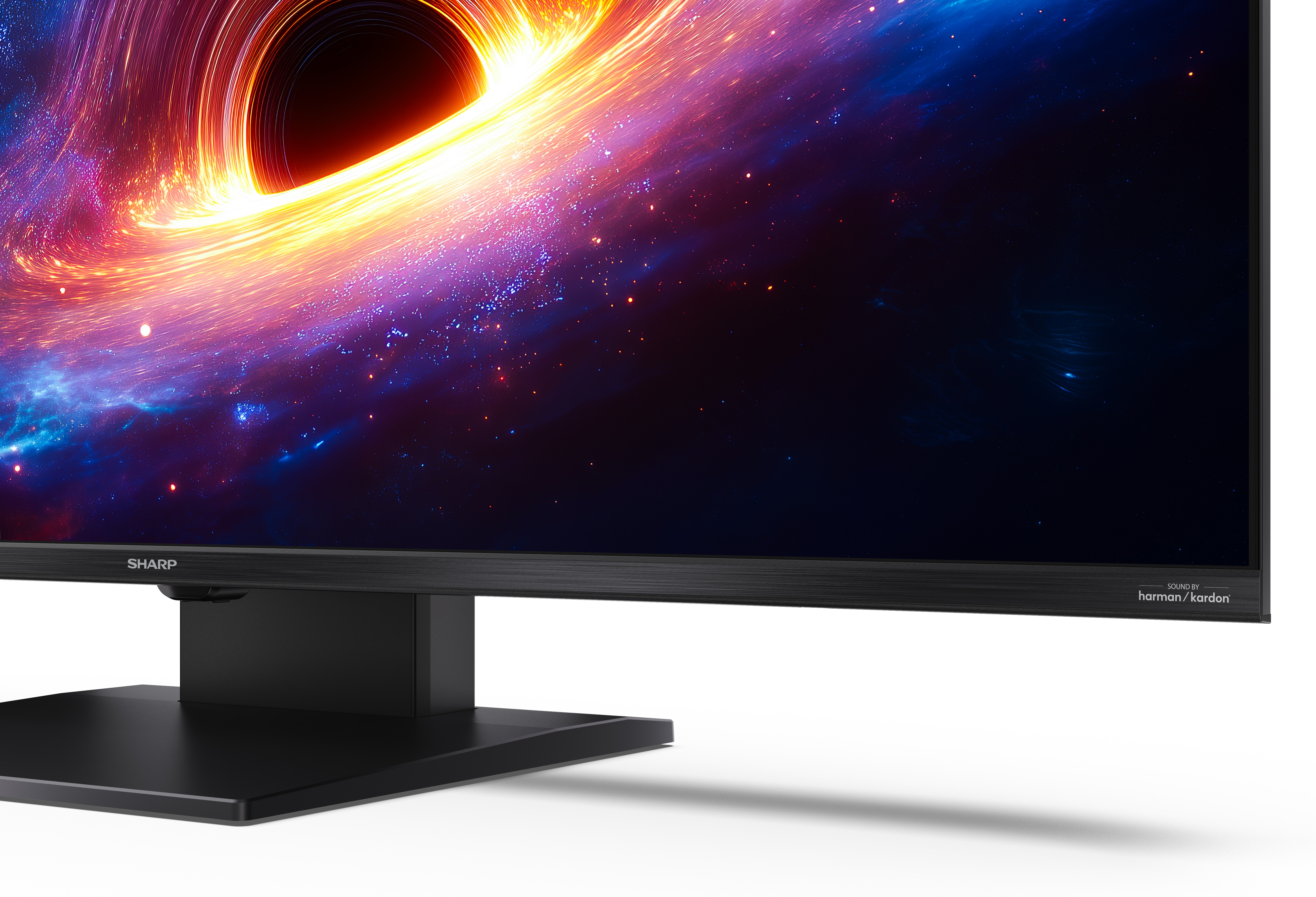 Czarny monitor Sharp wyświetla kolorowy obraz kosmiczny z czarną dziurą i gwiazdami.