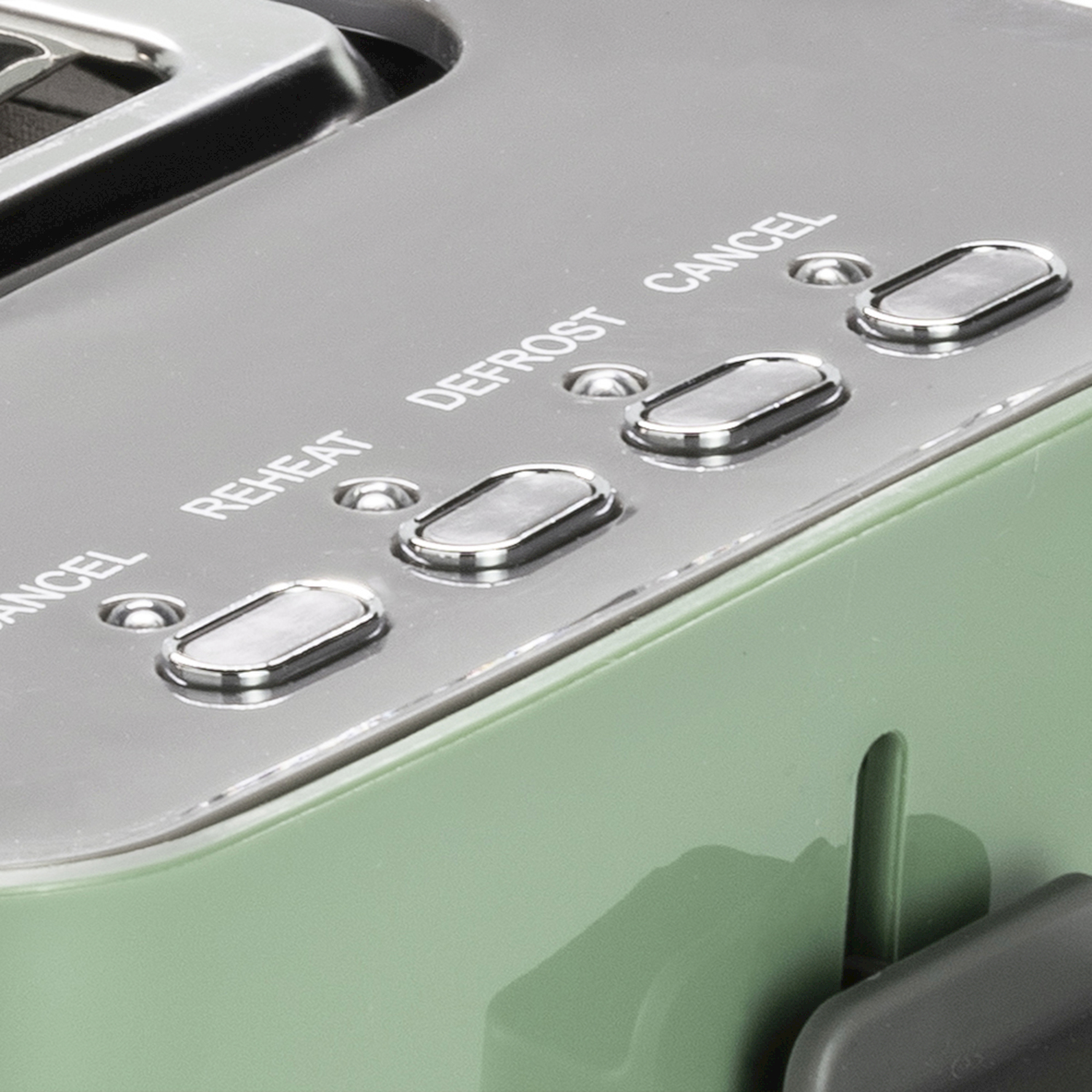 Primo piano dei pulsanti di un tostapane verde etichettati Reheat, Defrost e Cancel.