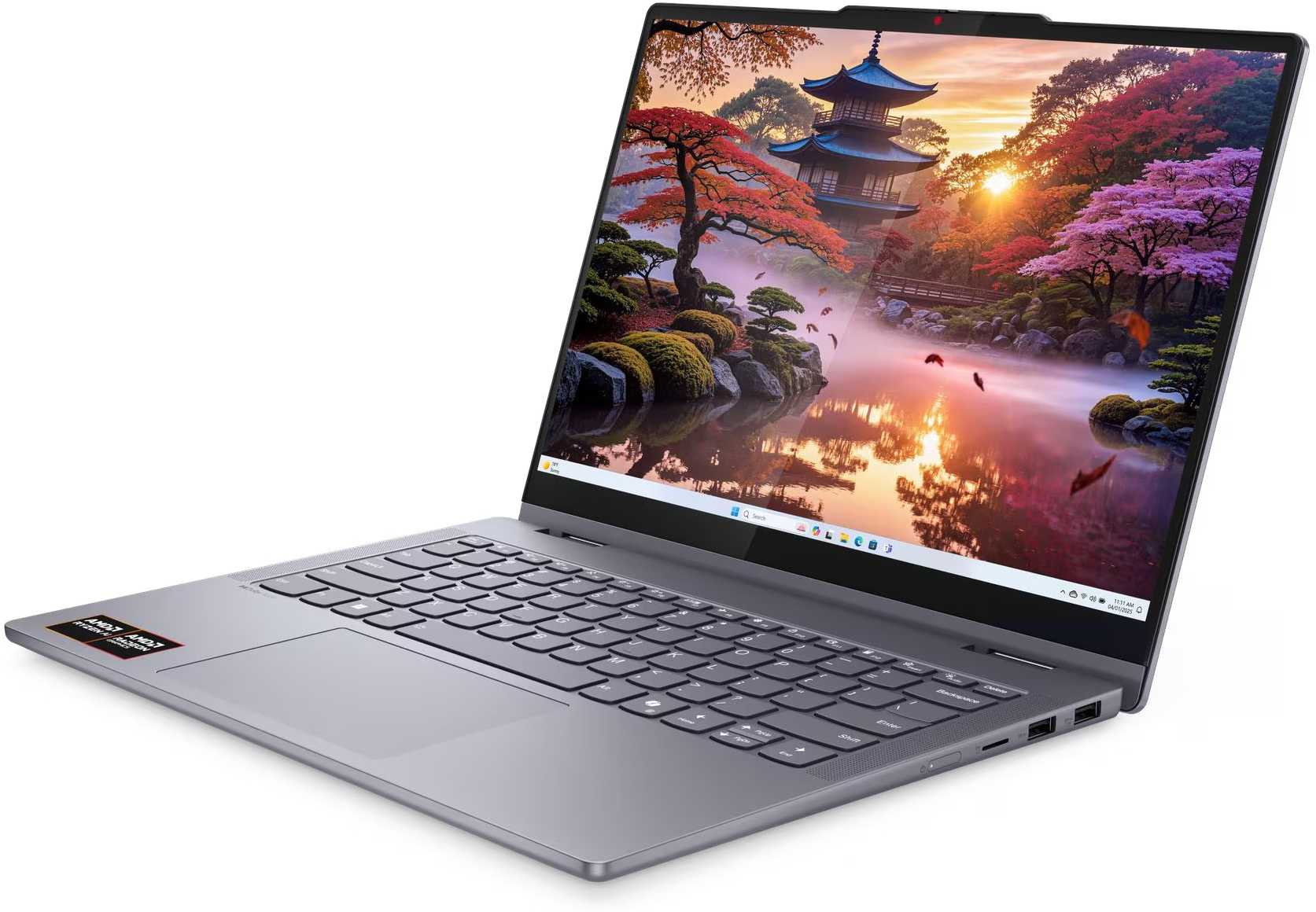 Egy szürke laptop nyitott képernyőjén egy japán templom táj látható naplementekor.
