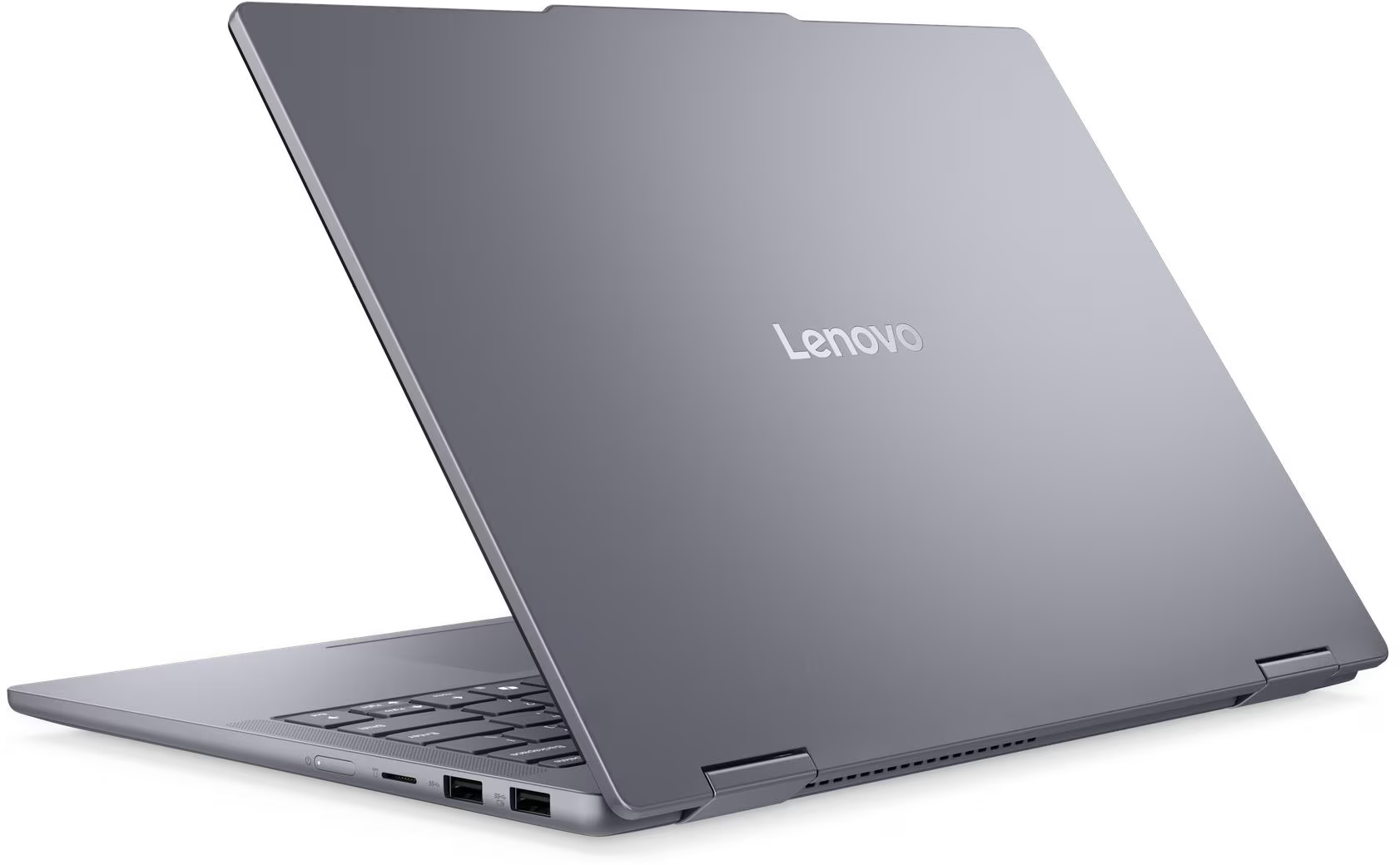 Egy szürke Lenovo laptop fehér felületen áll, a logó látható a csukott fedélen.