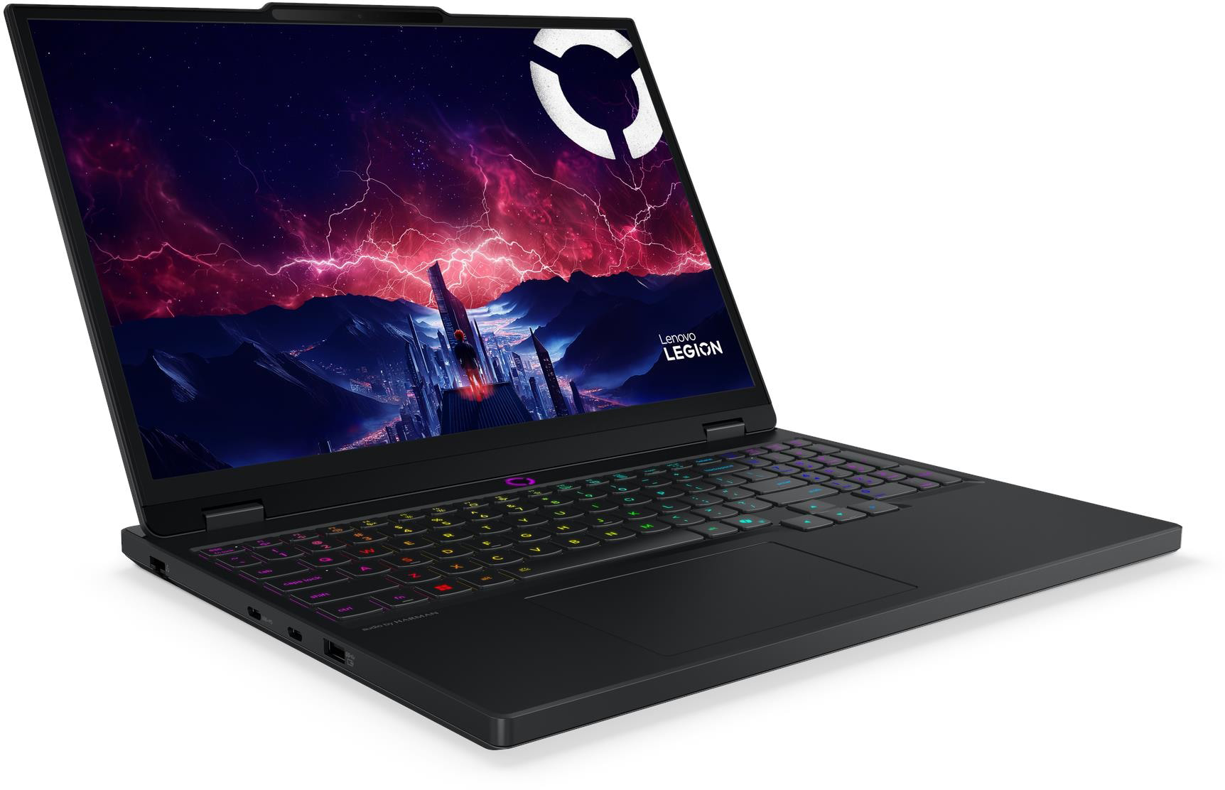 Egy fekete Lenovo Legion laptop háttérvilágítású billentyűzettel és futurisztikus várost ábrázoló képernyővel.