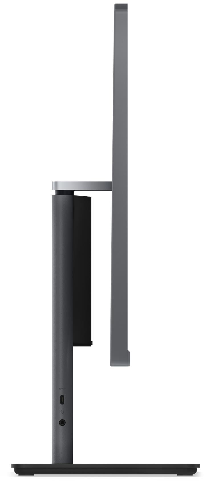 Vékony monitor oldalnézete függőleges állvánnyal, USB-C porttal és hangcsatlakozóval.