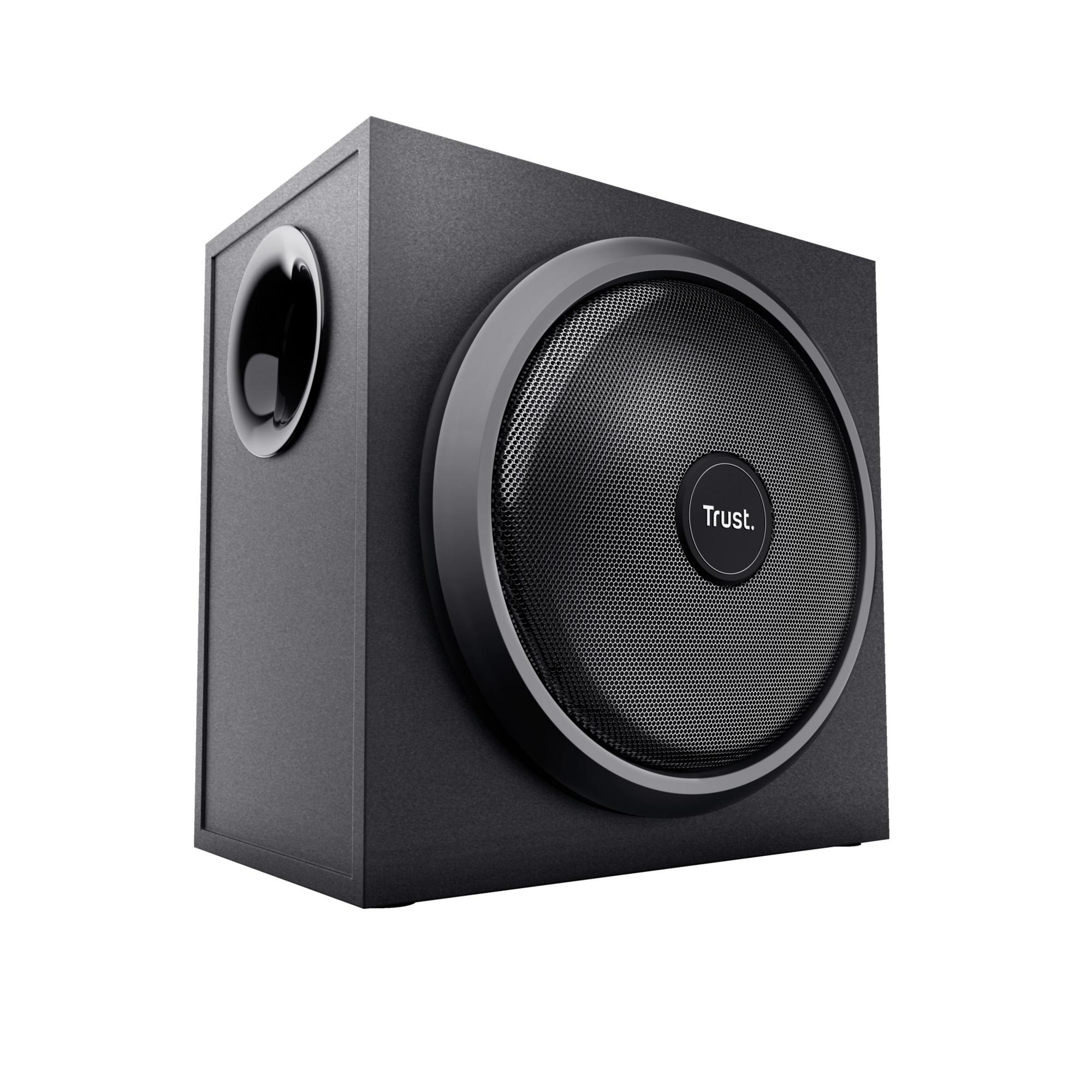 Ein schwarzer Trust Subwoofer mit rundem Lautsprechergitter und Port an der Seite vor weißem Hintergrund.