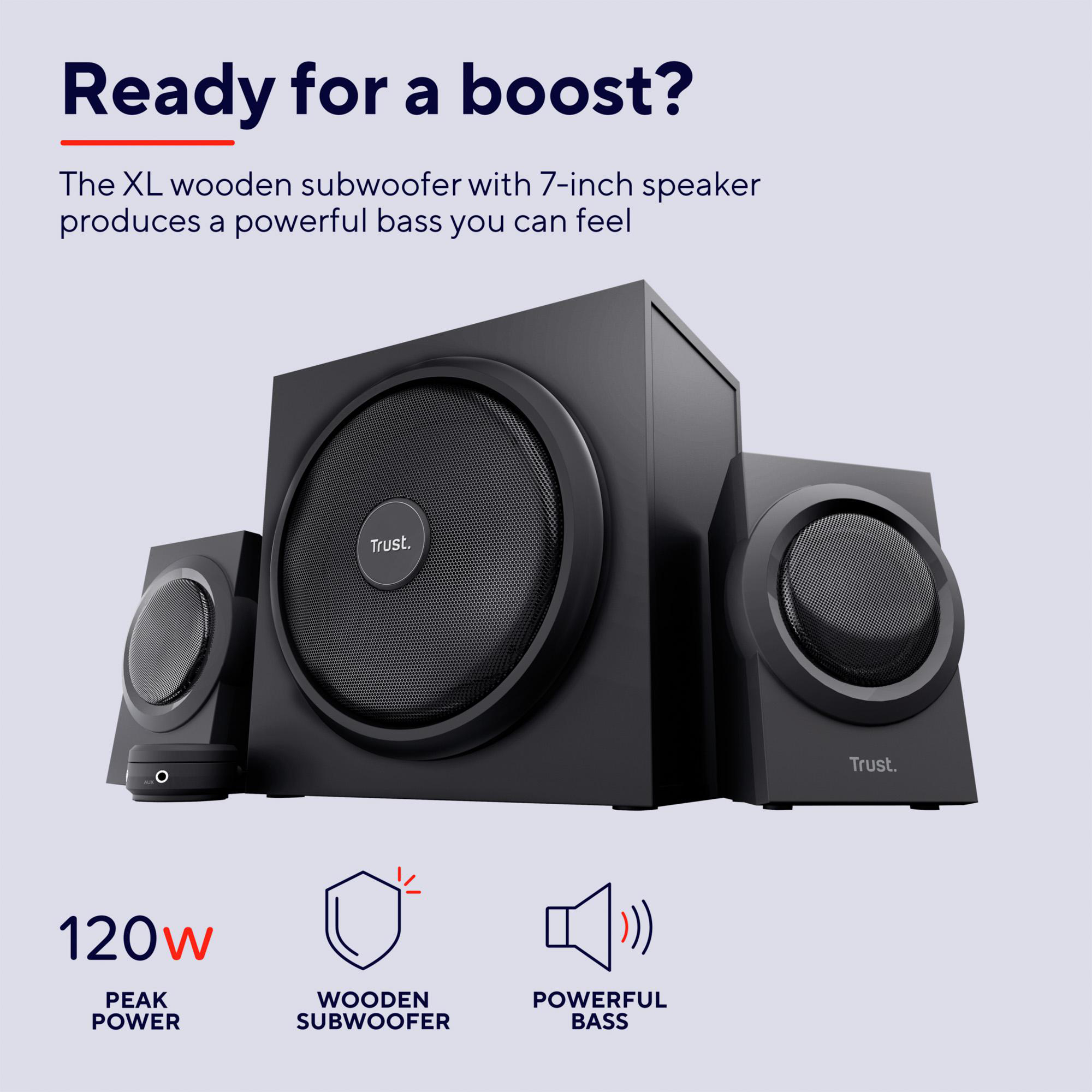 Ein Trust-Subwoofer mit zwei kleineren Lautsprechern auf hellem Hintergrund und Text darüber.