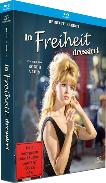 Blu-ray-Hülle mit blonde Frau im schwarzen Kleid, Titel „In Freiheit dressiert“ und FSK-18-Logo.