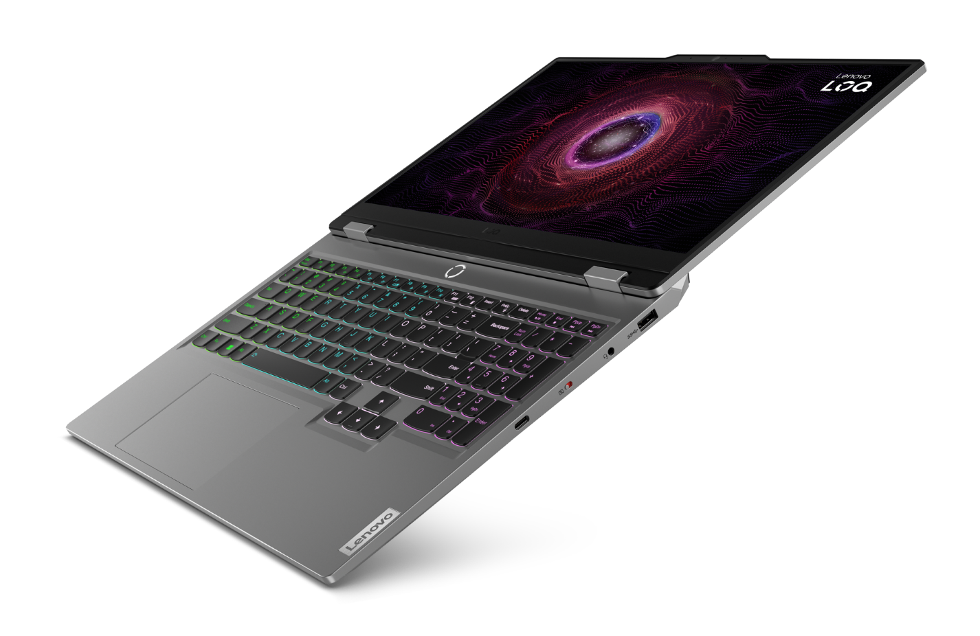 Szary laptop Lenovo LOQ z podświetlaną klawiaturą i kolorową, wirującą tapetą.