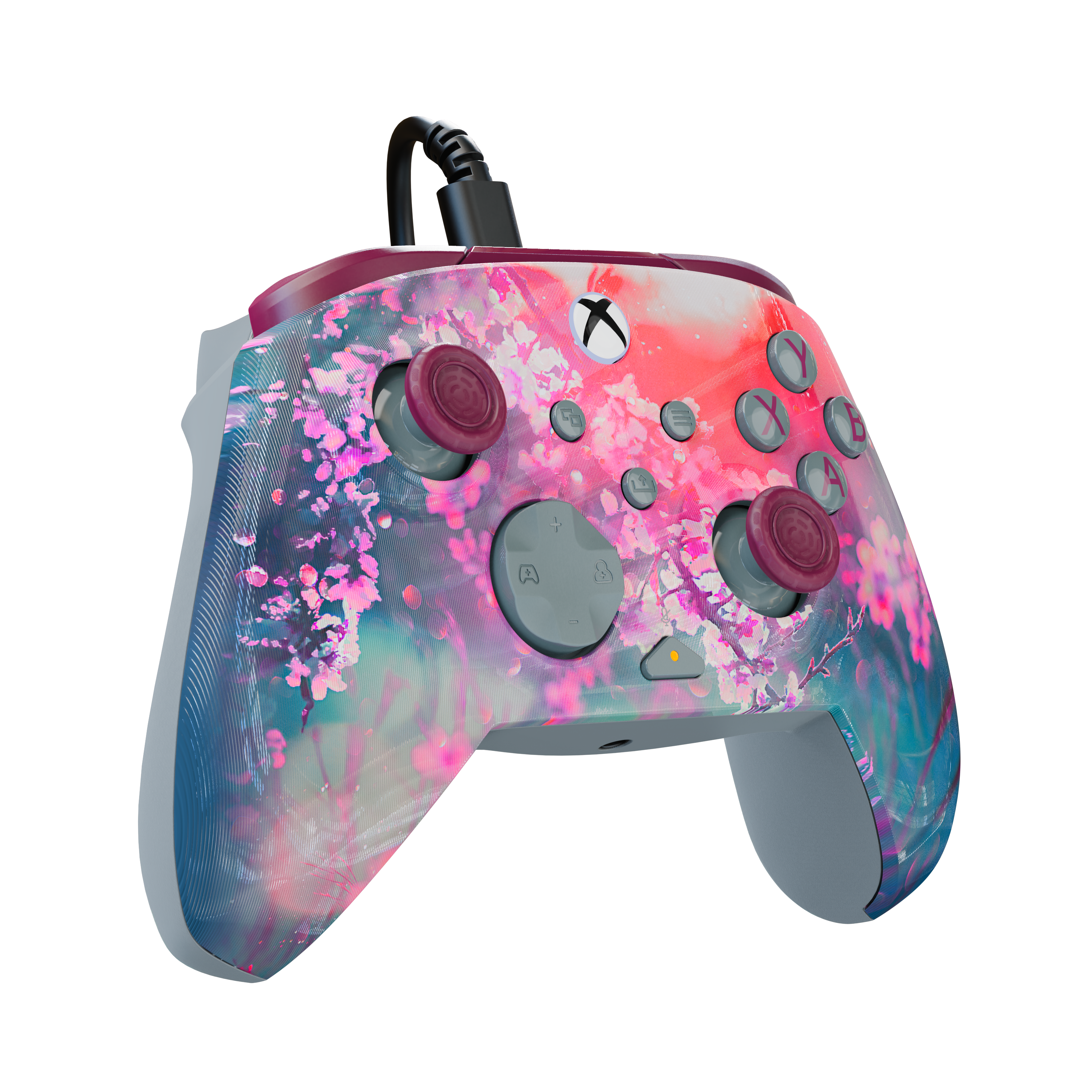 Manette de jeu filaire avec motif de fleurs de cerisier roses sur fond noir.