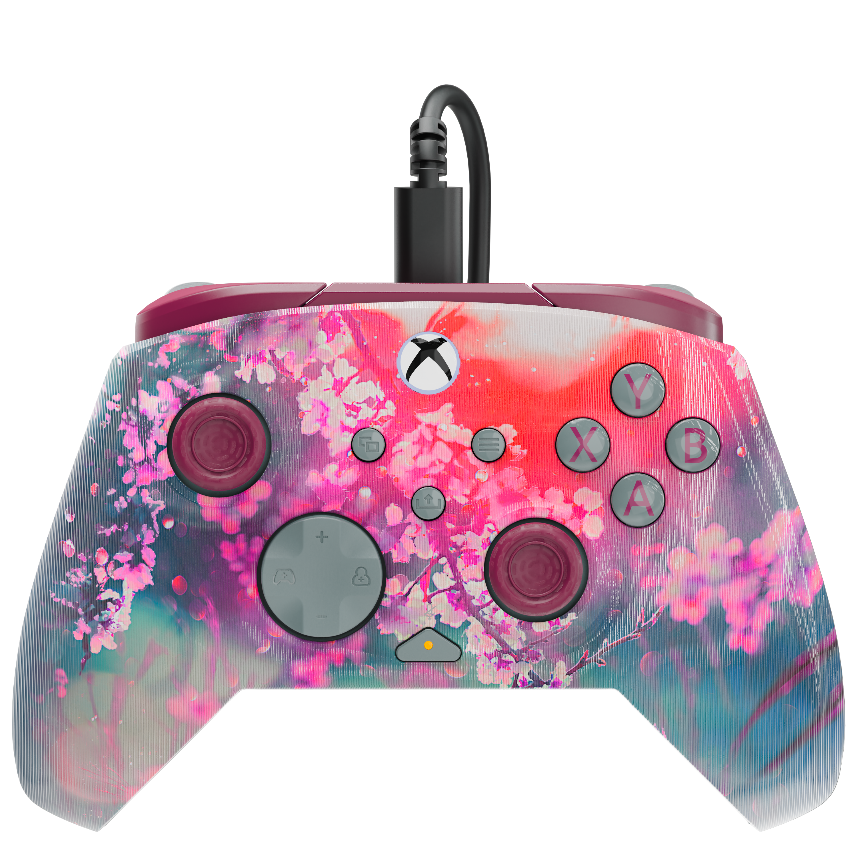 Une manette Xbox au design floral rose vif avec un câble attaché sur fond noir.