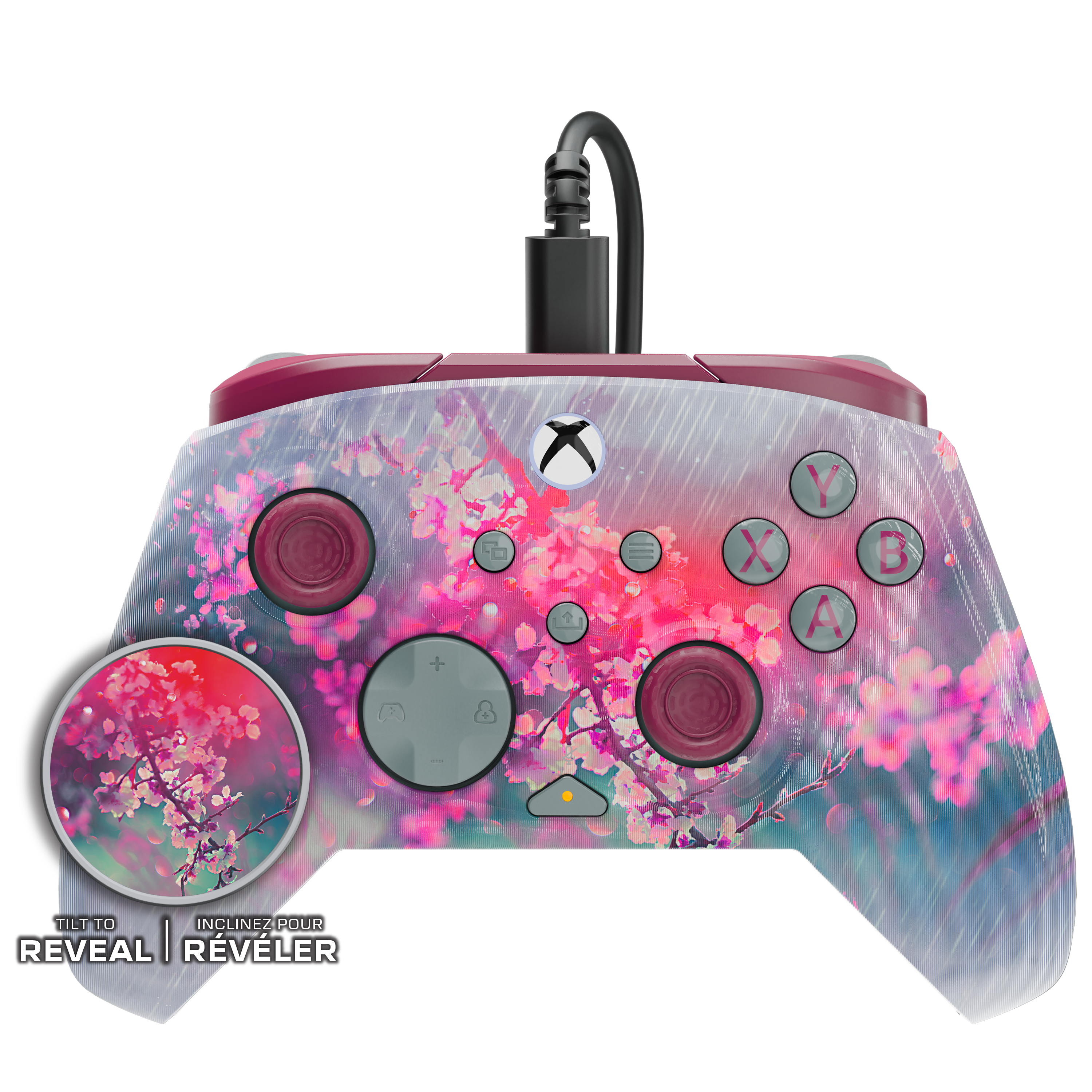 Une manette Xbox avec un motif de cerisiers en fleurs, un câble et un cercle grossissant.