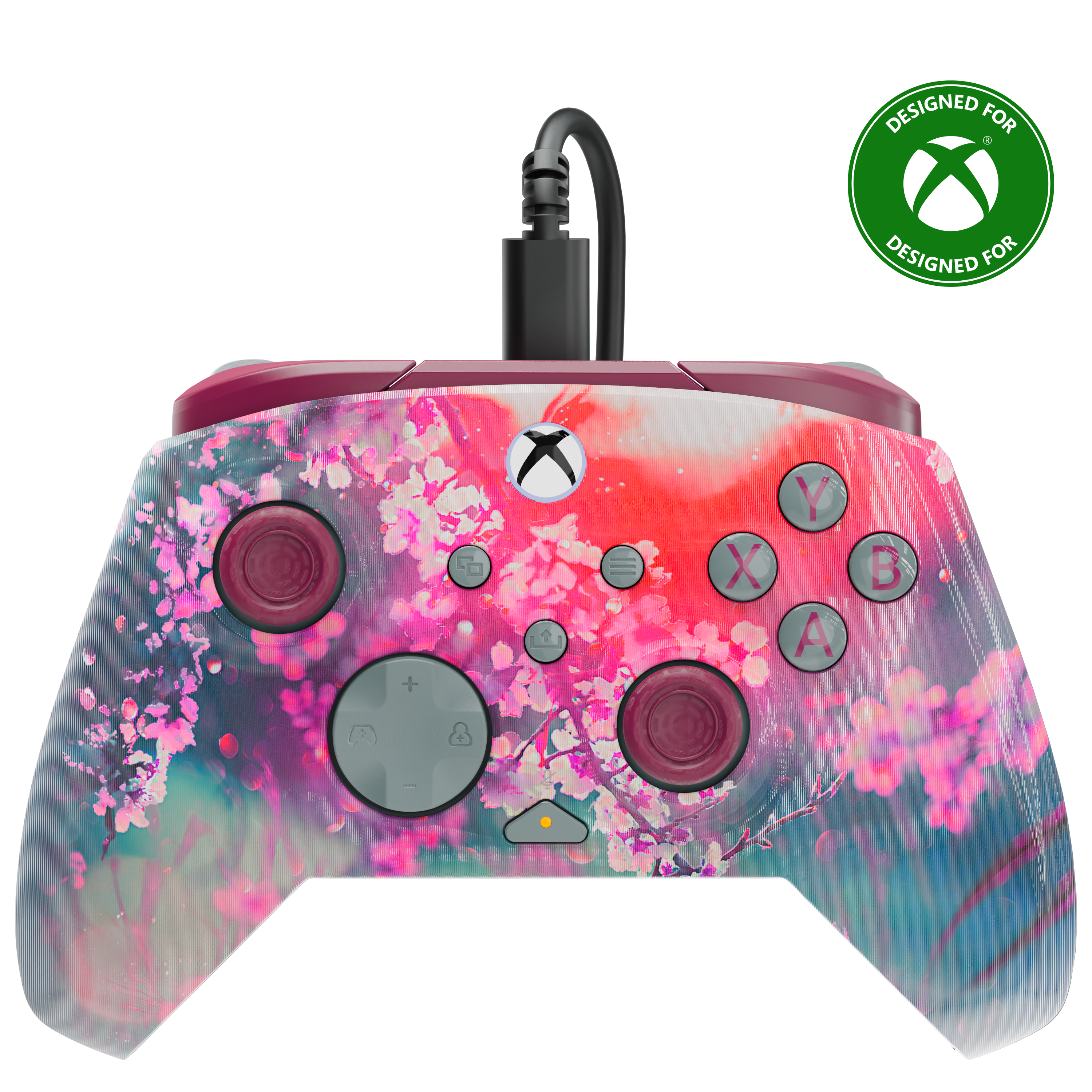 Une manette Xbox blanche avec un design vibrant de fleurs de cerisier roses sur fond noir.