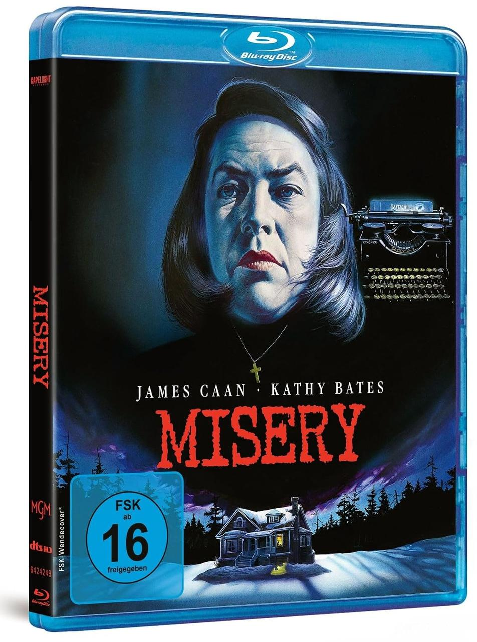Blu-ray-Hülle des Films Misery mit Kathy Bates, einer Schreibmaschine und einem verschneiten Haus unten.