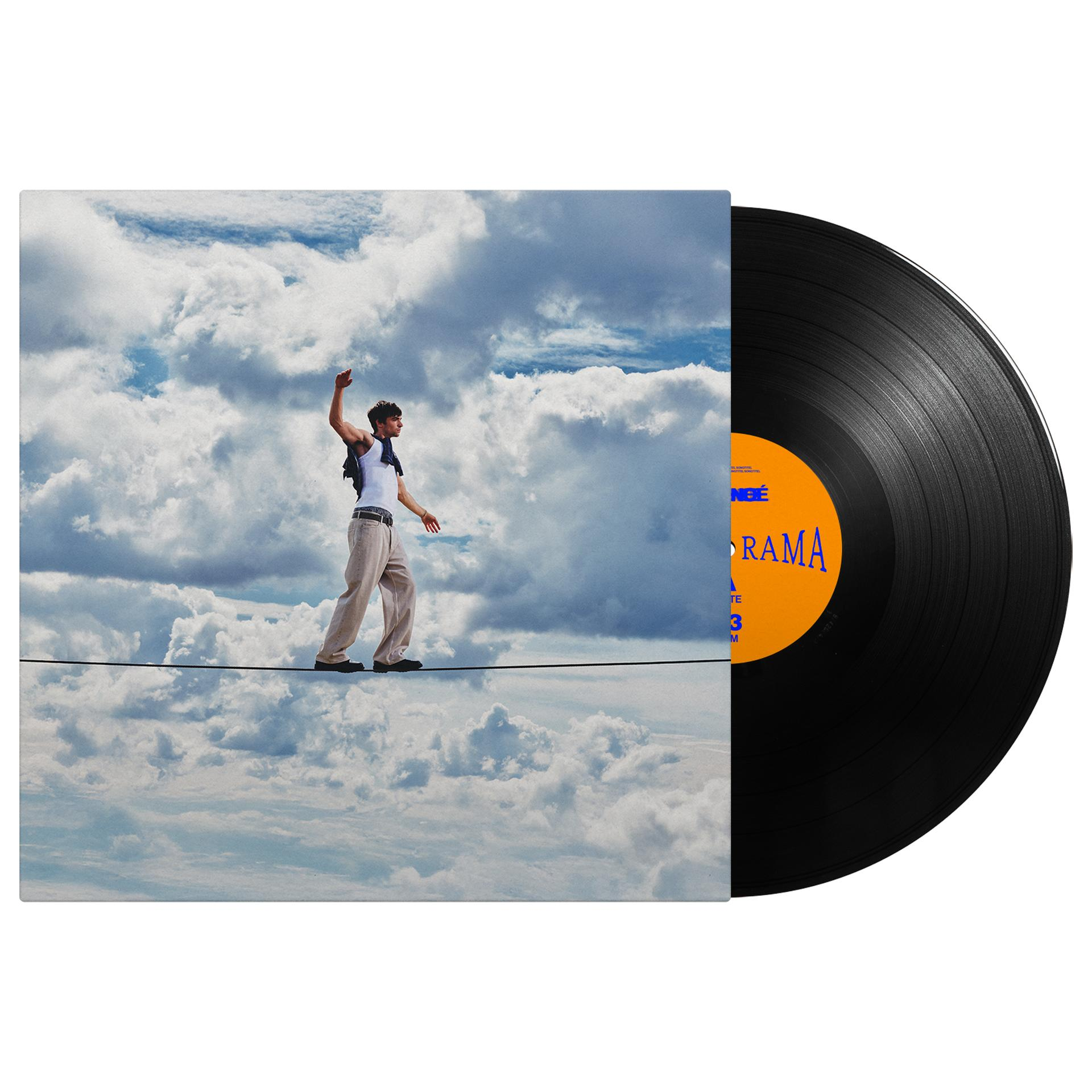 Eine Schallplatte neben dem Cover, auf dem ein Mann auf einem Seil vor einem Wolkenhimmel balanciert.