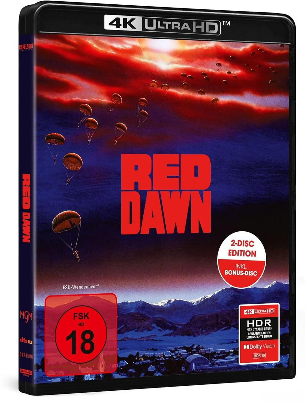 Red Dawn 4K Ultra HD Blu-ray-Hülle mit Fallschirmspringern vor einem roten Himmel und schneebedeckten Bergen.