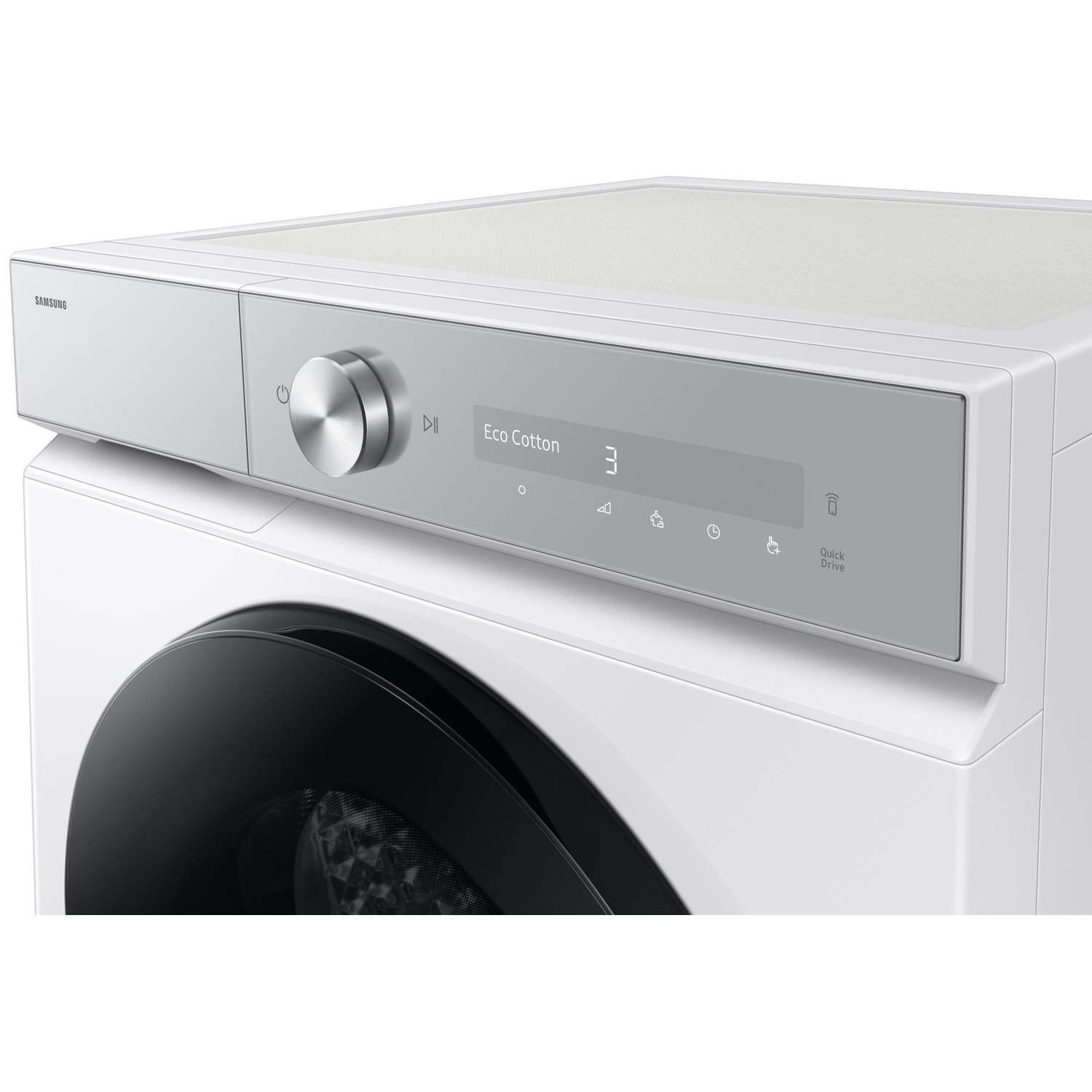 Modern white washing machine with a metal dial and digital display showing Eco Cotton.