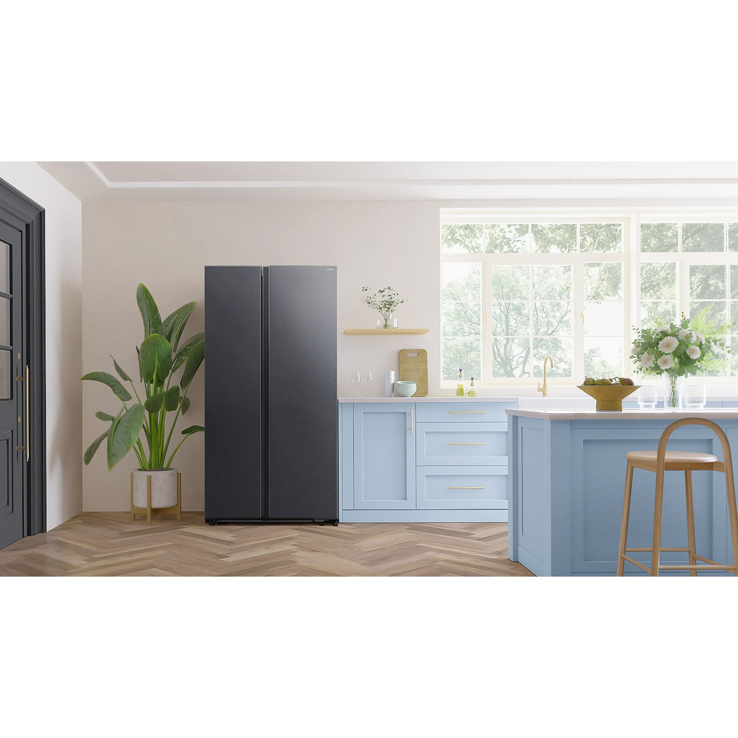 Modern kitchen featuring a dark grey refrigerator, light blue cabinets, wooden floors, and a large plant.