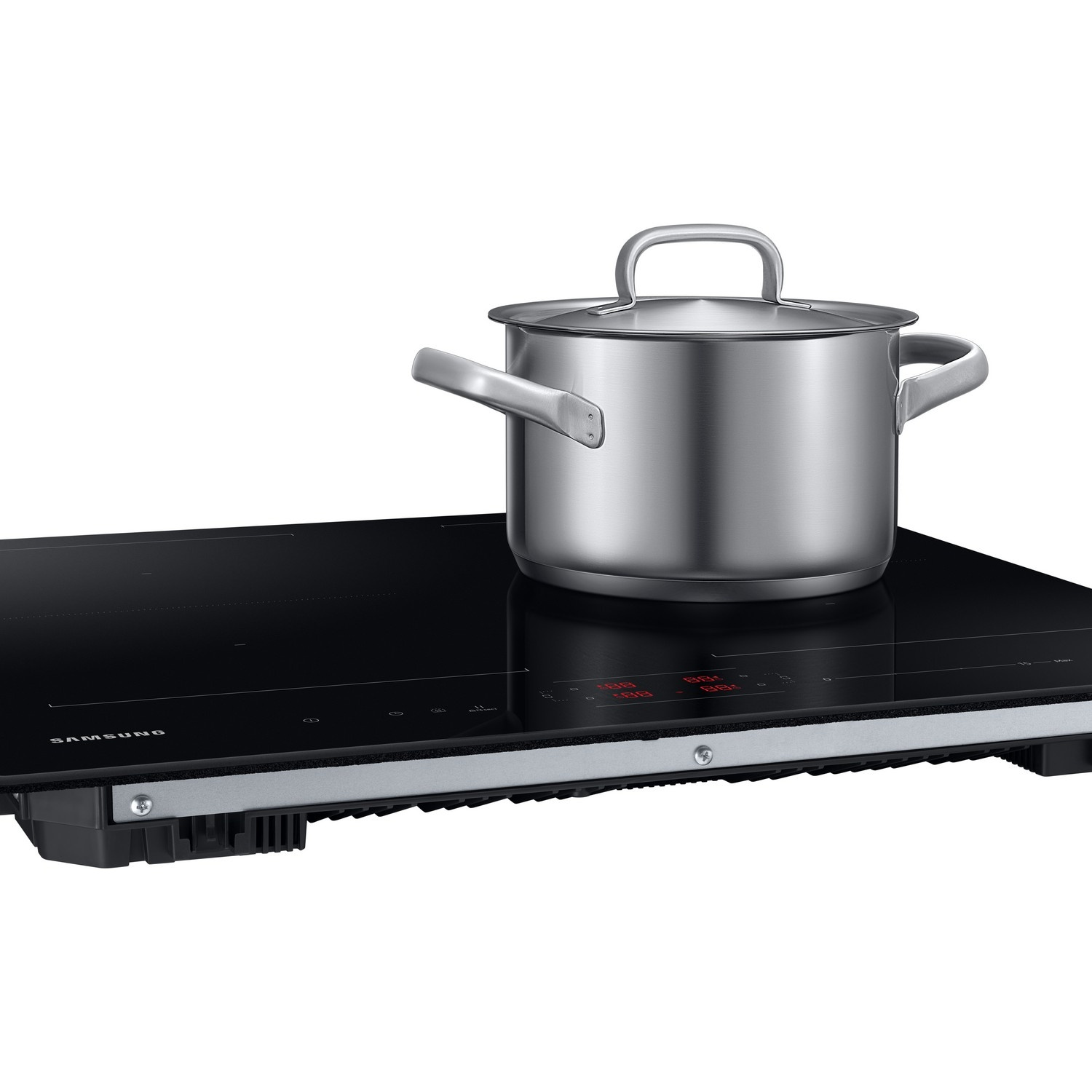 A silver pot with a lid sits on a black Samsung induction cooktop against a white background.