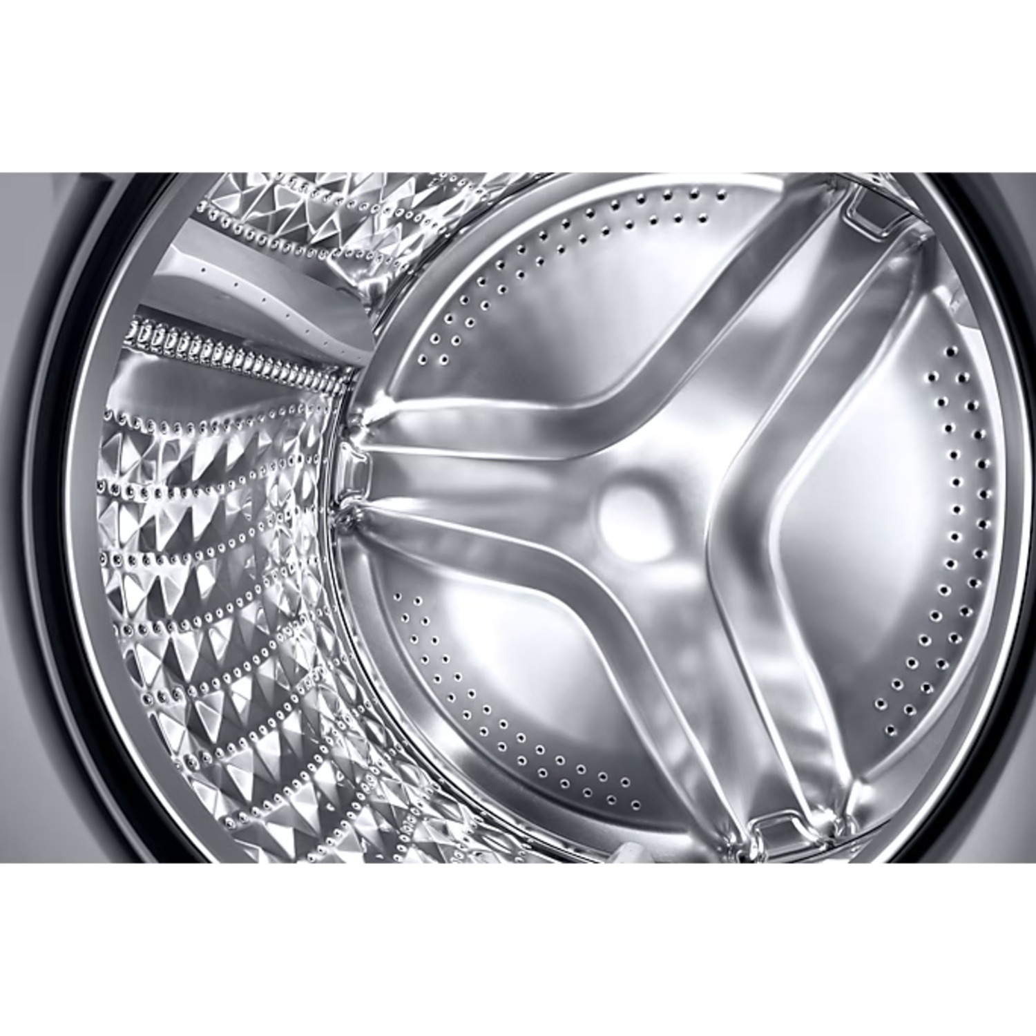 Shiny, patterned stainless steel drum inside a washing machine with holes.