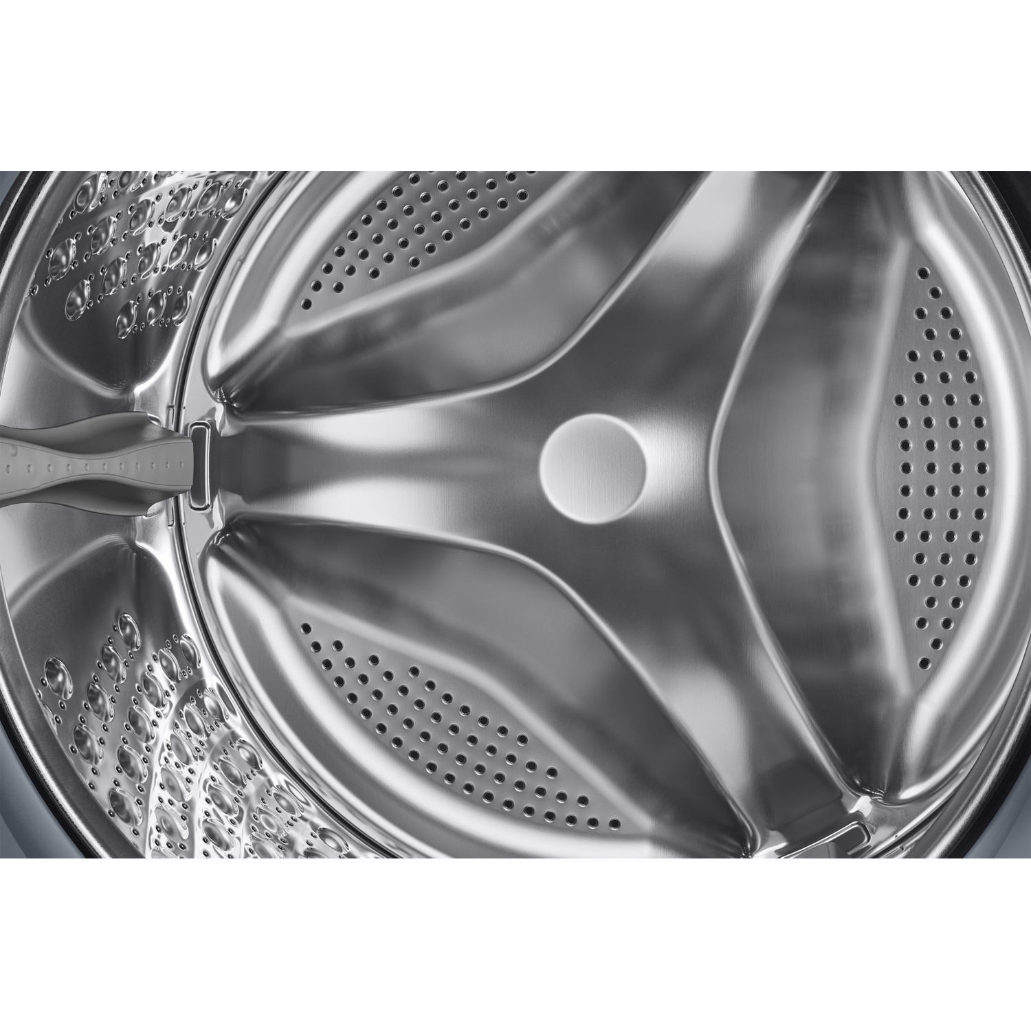 The interior of a silver stainless steel washing machine drum with small holes.