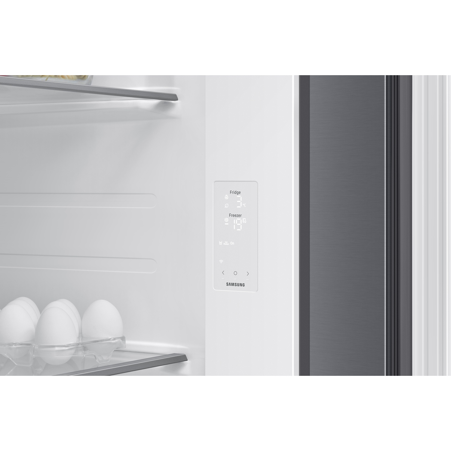 Inside view of a white Samsung refrigerator with digital control panel and eggs on a shelf.