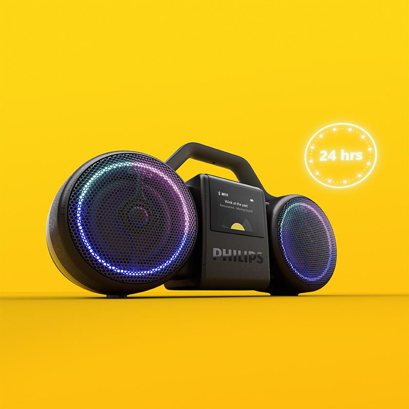 Ein schwarzer Philips-Boombox-Lautsprecher mit blauer LED-Beleuchtung auf einem leuchtend gelben Hintergrund.