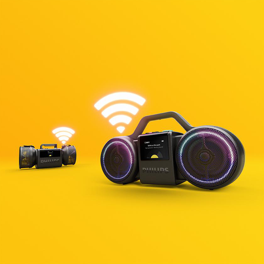 Zwei schwarze Philips-Lautsprecher mit Leuchtringen und WLAN-Symbolen vor gelbem Hintergrund.