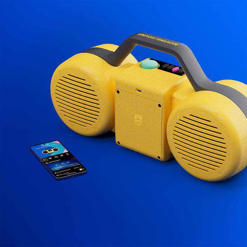 Ein gelber Retro-Ghettoblaster mit schwarzem Griff und Lautsprechern steht auf blauem Untergrund, neben einem Smartphone.