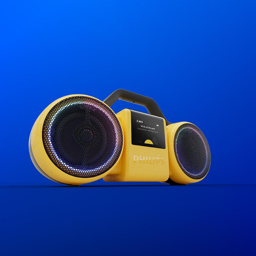 Ein gelber Philips-Boombox-Lautsprecher steht vor einem hellblauen Hintergrund.