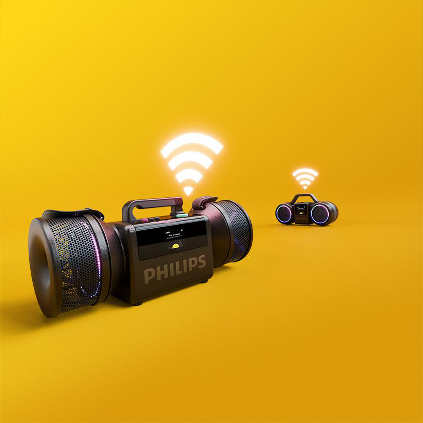Zwei schwarze Philips-Lautsprecher mit leuchtenden WLAN-Symbolen stehen vor einem hellgelben Hintergrund.