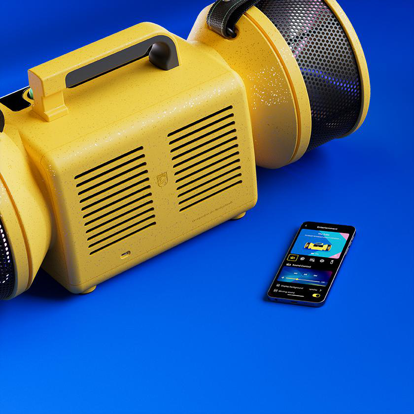 Gelber Retro-Lautsprecher und Smartphone auf blauem Hintergrund.