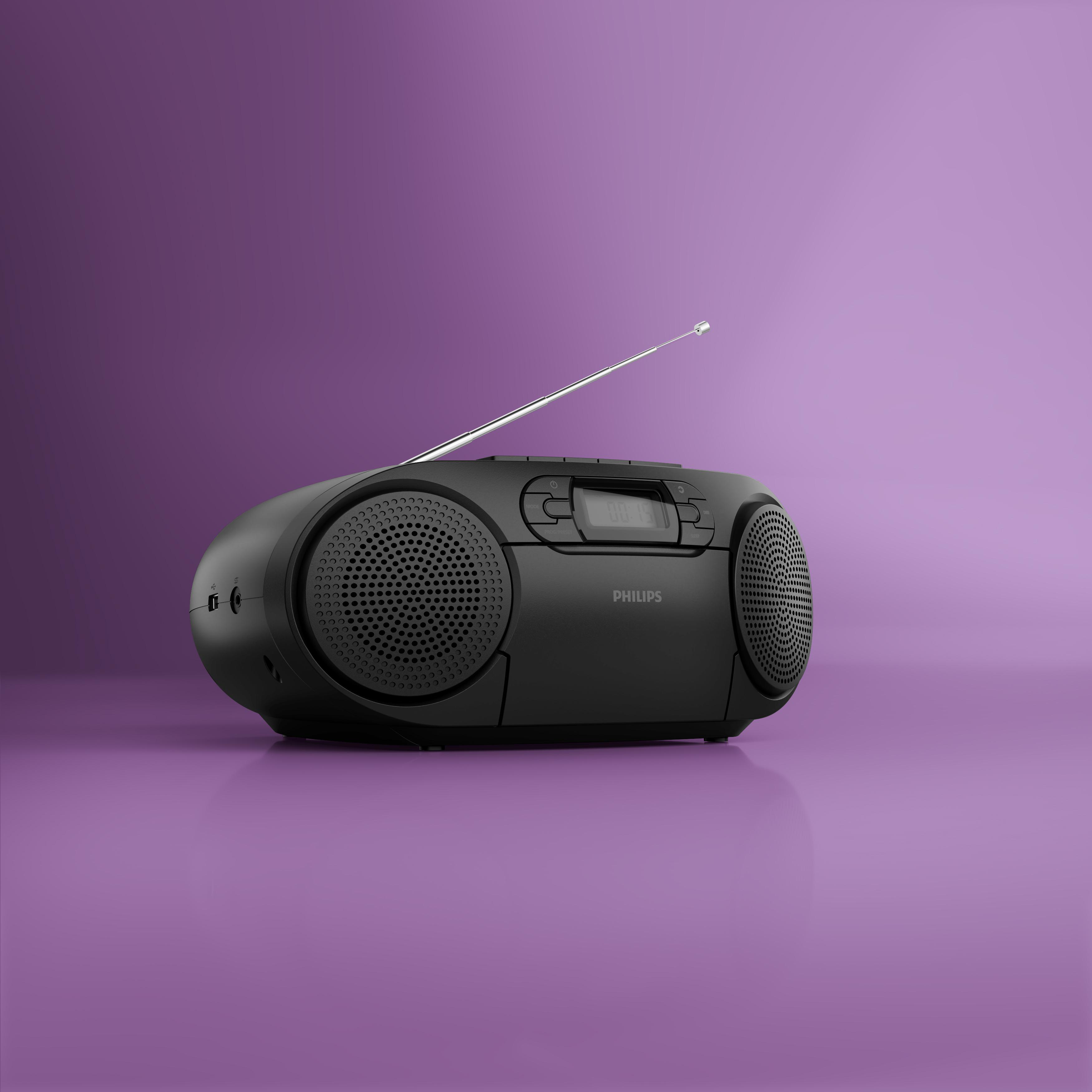 Ein schwarzes Philips-Radio mit Teleskopantenne steht auf einer lilafarbenen Oberfläche.