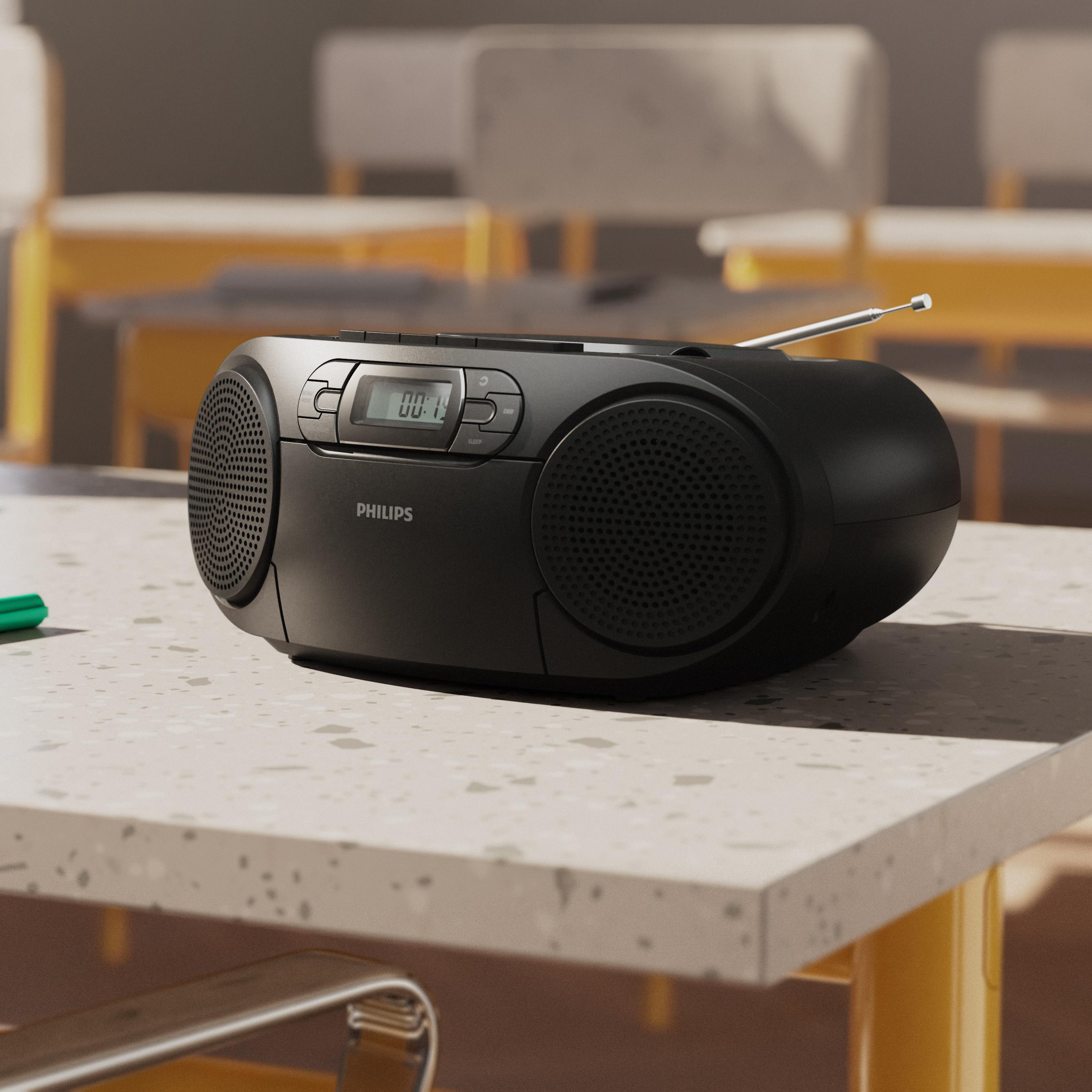 Ein schwarzes Philips Radio mit Digitaldisplay und ausgefahrener Antenne auf einem Tisch.