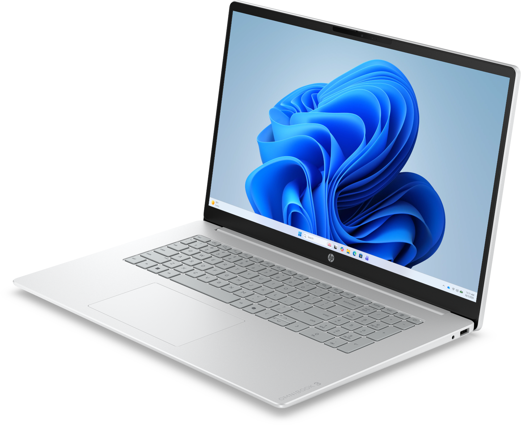Egy ezüst laptop kék absztrakt virággal a képernyőn fekete háttér előtt.