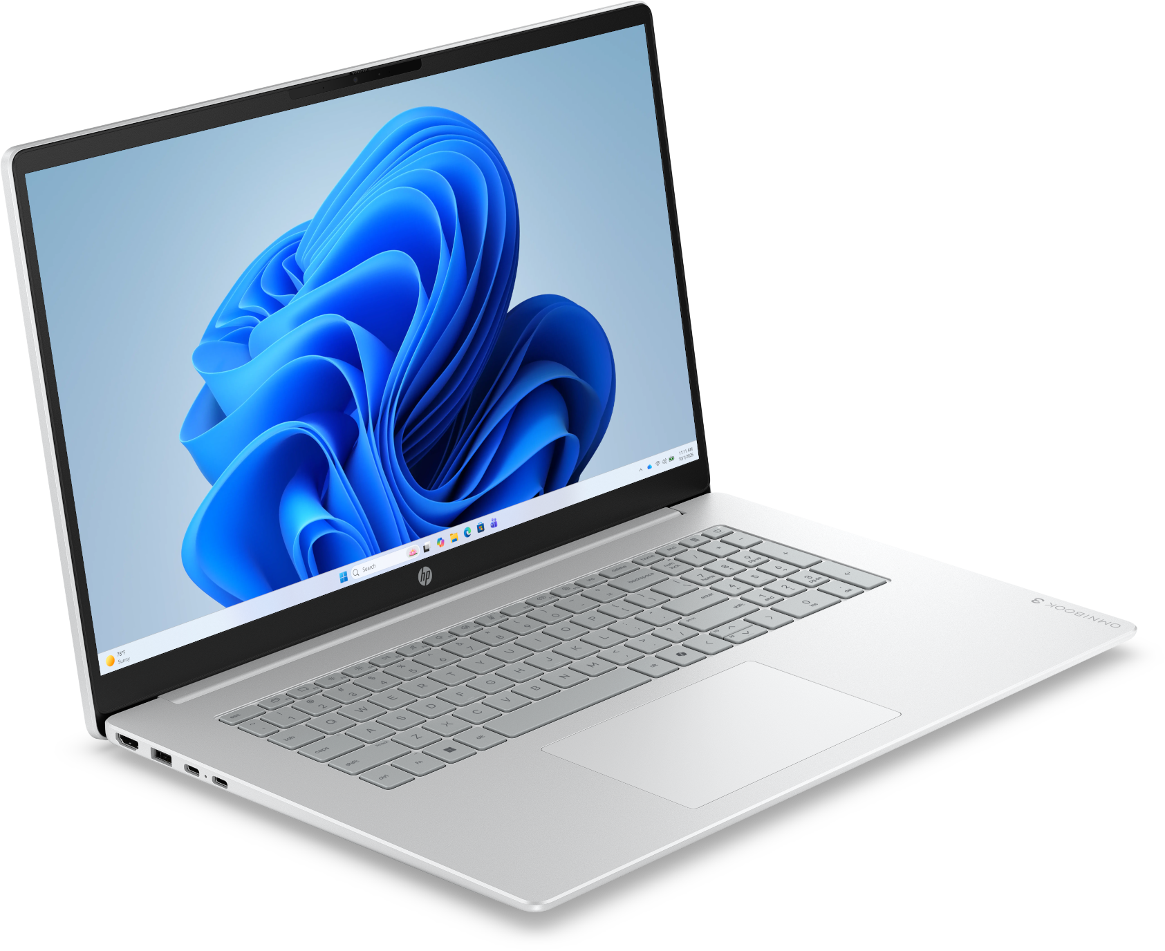 Ezüstszínű laptop, képernyőjén kék hullámos háttérképpel.
