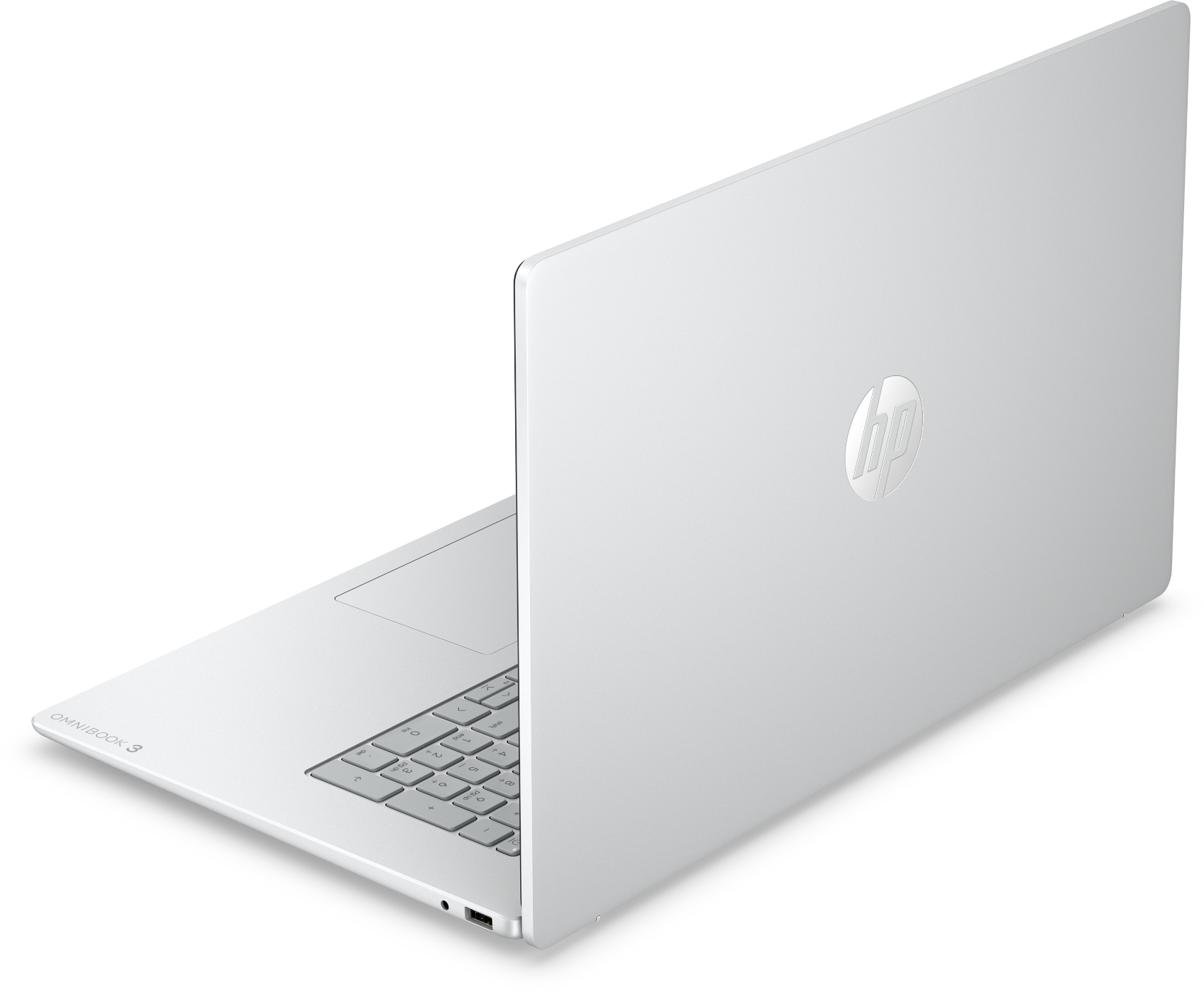 Egy ezüst színű HP Omnibook 3 laptop háromnegyedes nézetben, fekete háttér előtt.