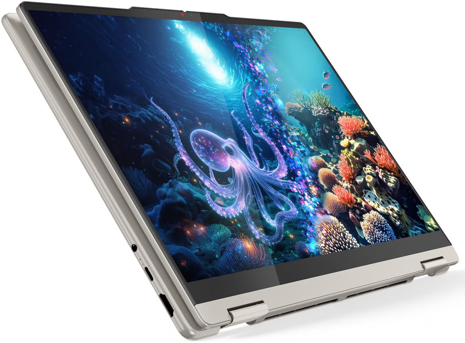 Egy nyitott ezüst laptop képernyőjén egy ragyogó polip látható egy színes ví alatti jelenetben.