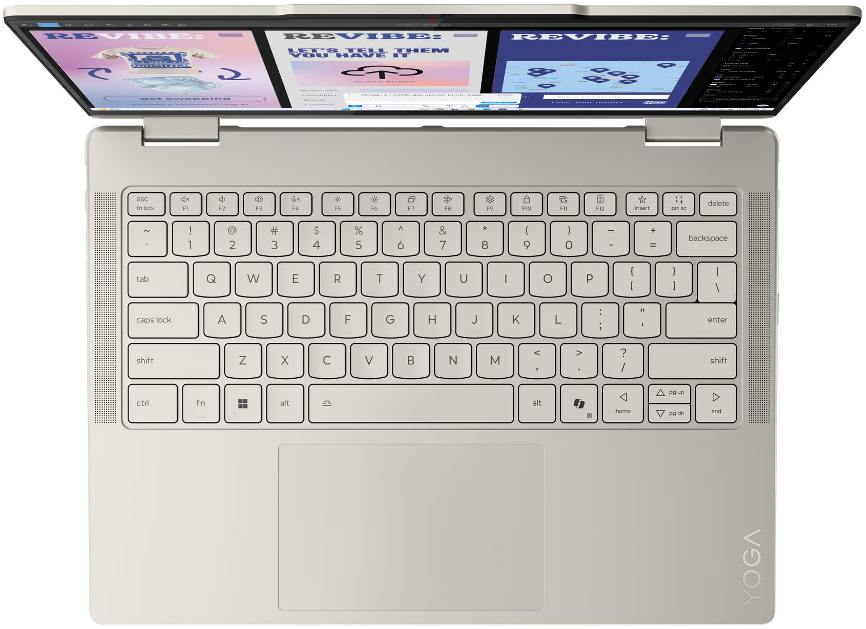 Felülnézet egy világos Yoga laptopról, amelyen weboldal látható a képernyőn és QWERTY billentyűzet.