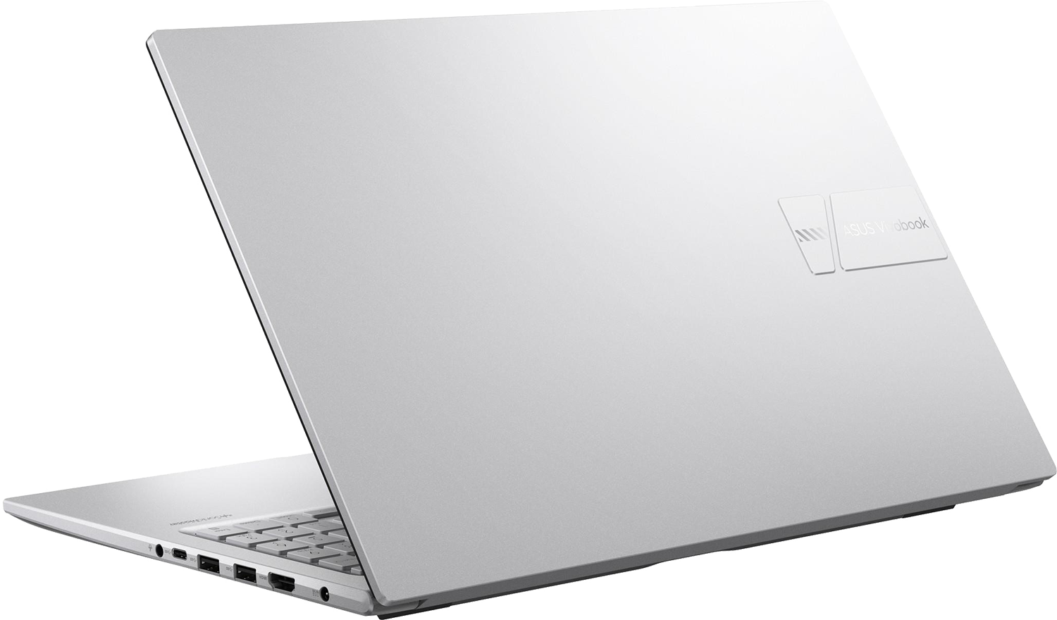 Egy ezüst színű ASUS Vivobook laptop enyhén nyitva fekete háttér előtt, látható portokkal.