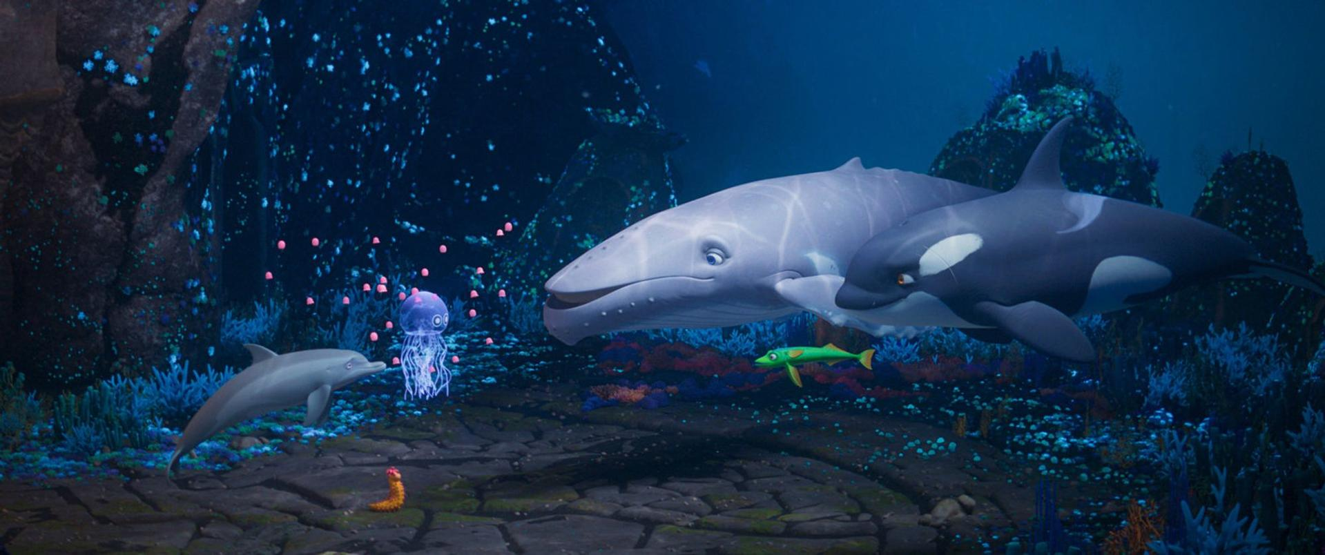 Unterwasserszene mit verschiedenen Meeresbewohnern wie Walen, einem Delfin und leuchtenden Quallen.