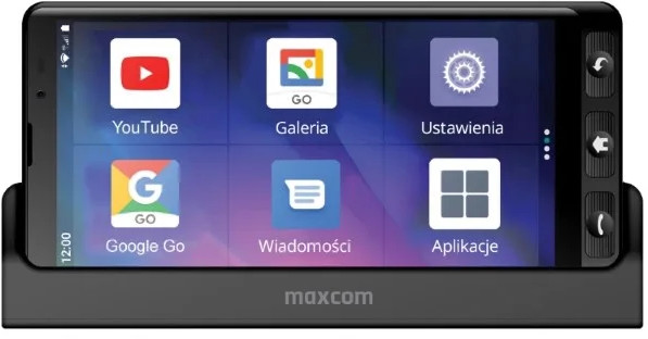 Smartfon w stacji ładującej pokazuje ekran główny z dużymi ikonami aplikacji YouTube, Galeria i Google Go.
