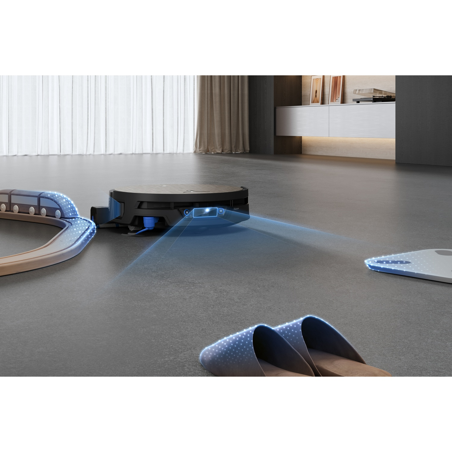 Un robot aspirapolvere proietta fasci di luce blu in una stanza per rilevare ostacoli come pantofole, una bilancia e un trenino.