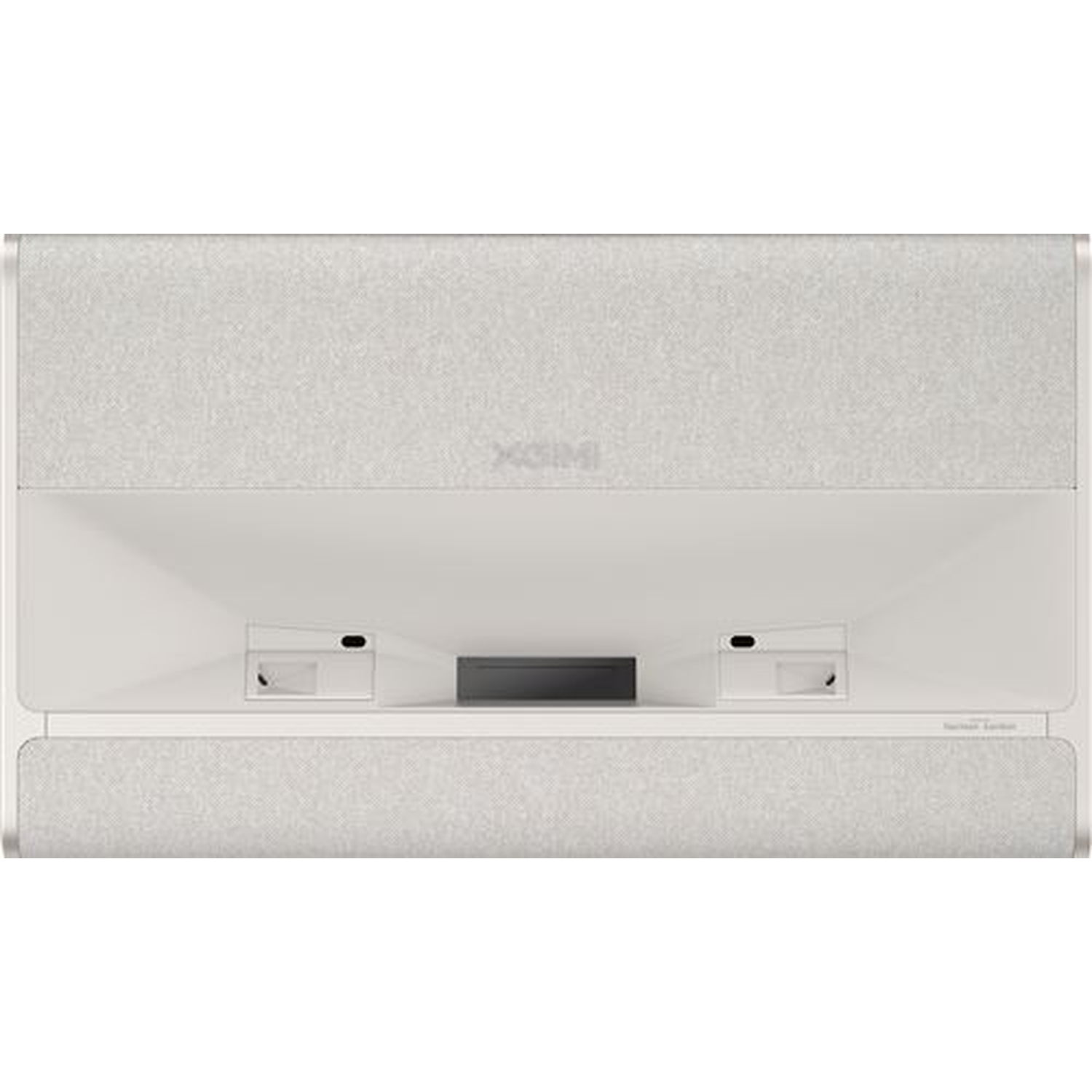 Een witte projector met stoffen panelen, centrale lens en ingebouwde luidsprekers op een lichte achtergrond.